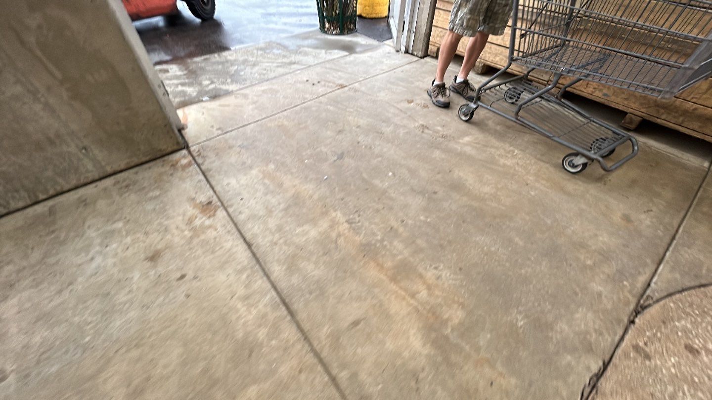 Concrete sidewalk cleaning and degreasing by Northern Power Washing LLC.