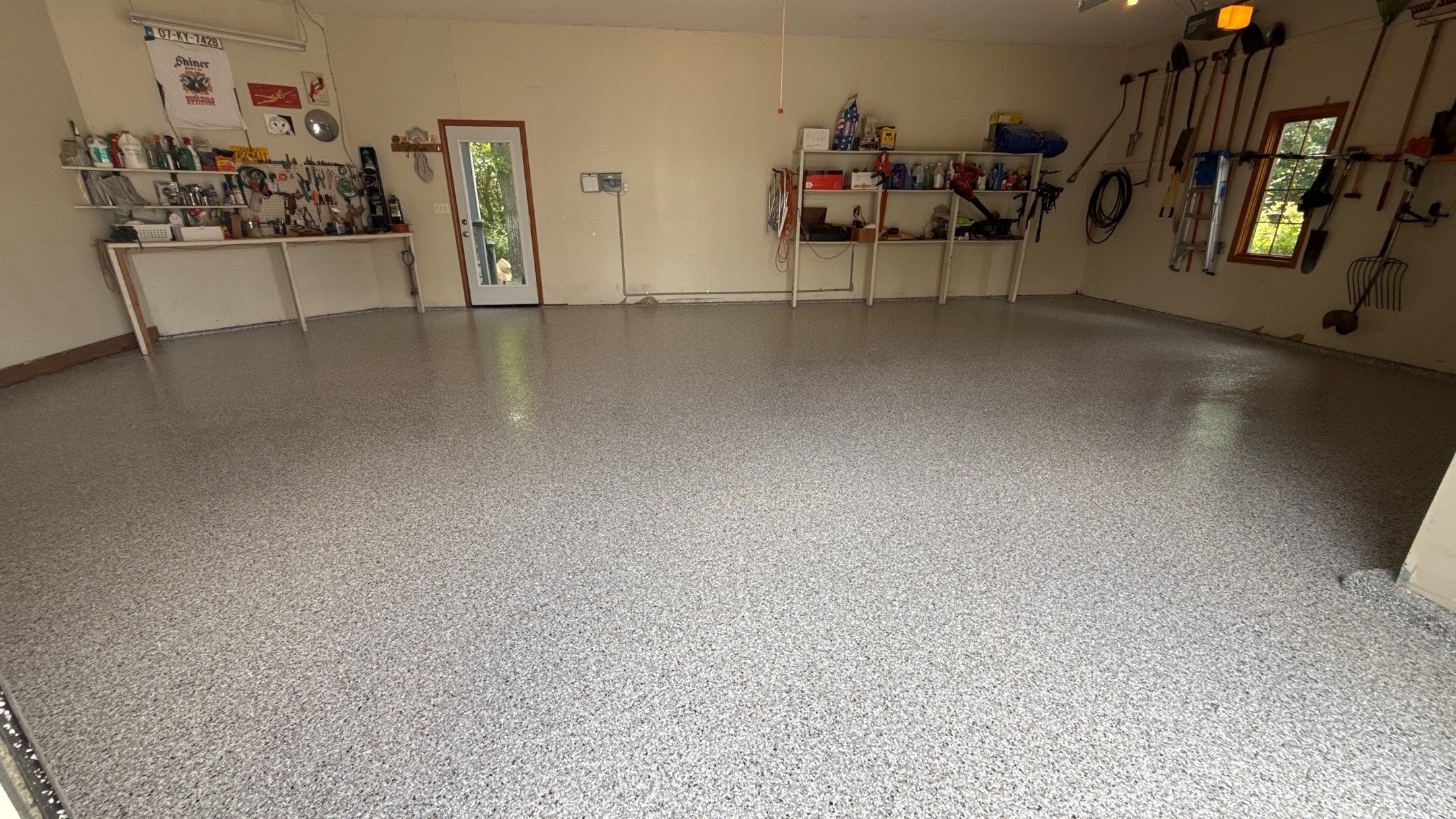 The Perfect Day To Install A Beautiful Coyote Flake Floor by Banner Garage