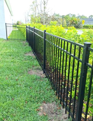 Aluminum Fence Installation using Black 3 Rail Aluminum Fence