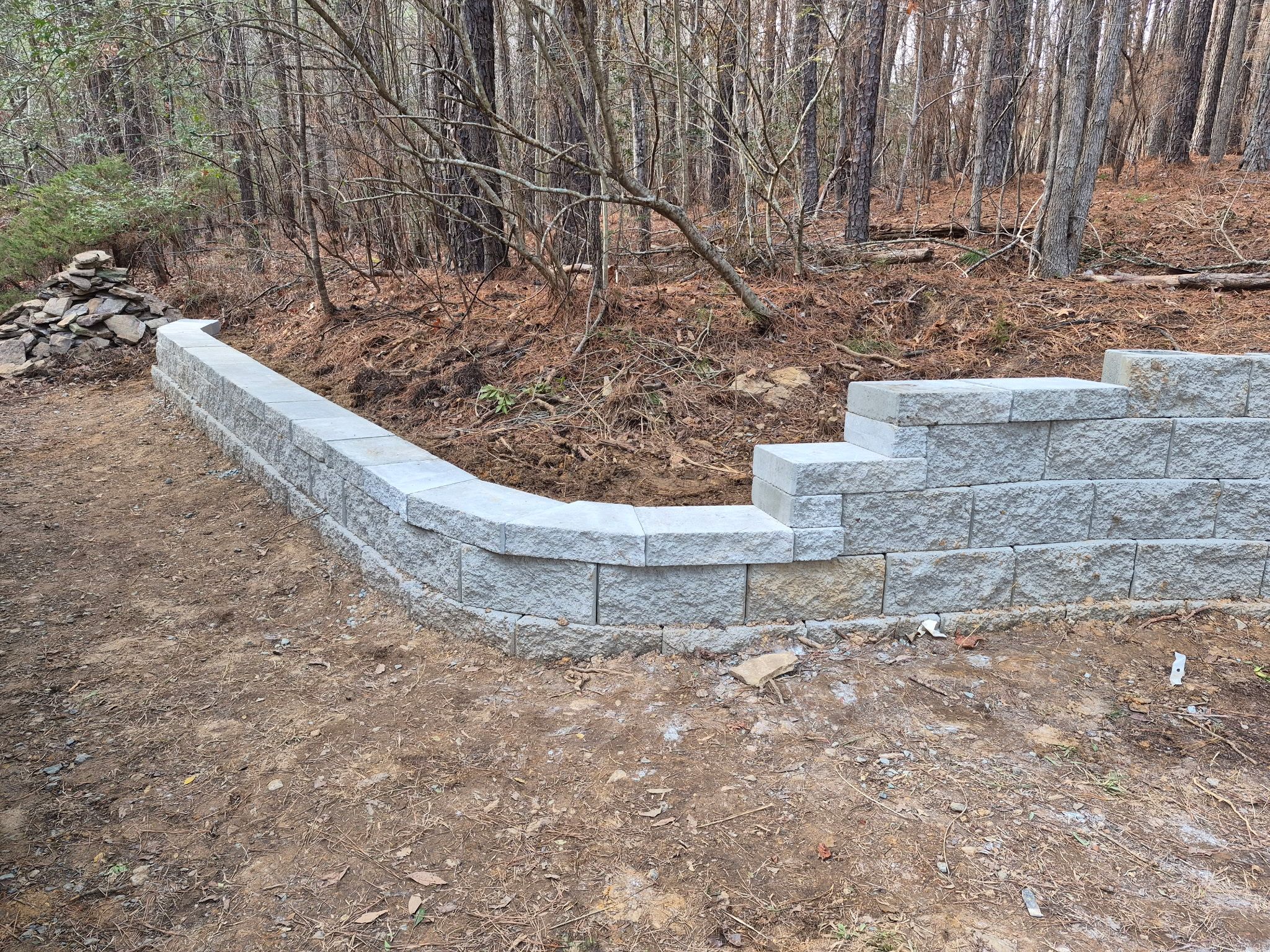 Pittsboro Outdoor Living Transformation – Retaining Wall, Paver Patio & Elevated Deck by Elite Remodeling and Design LLC