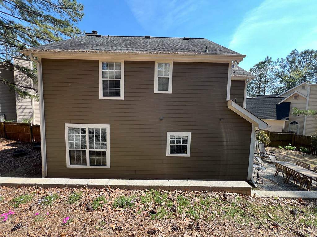 Green Exterior Paint and James Hardie Siding Transformation in Smyrna, GA by Nelson Exteriors 