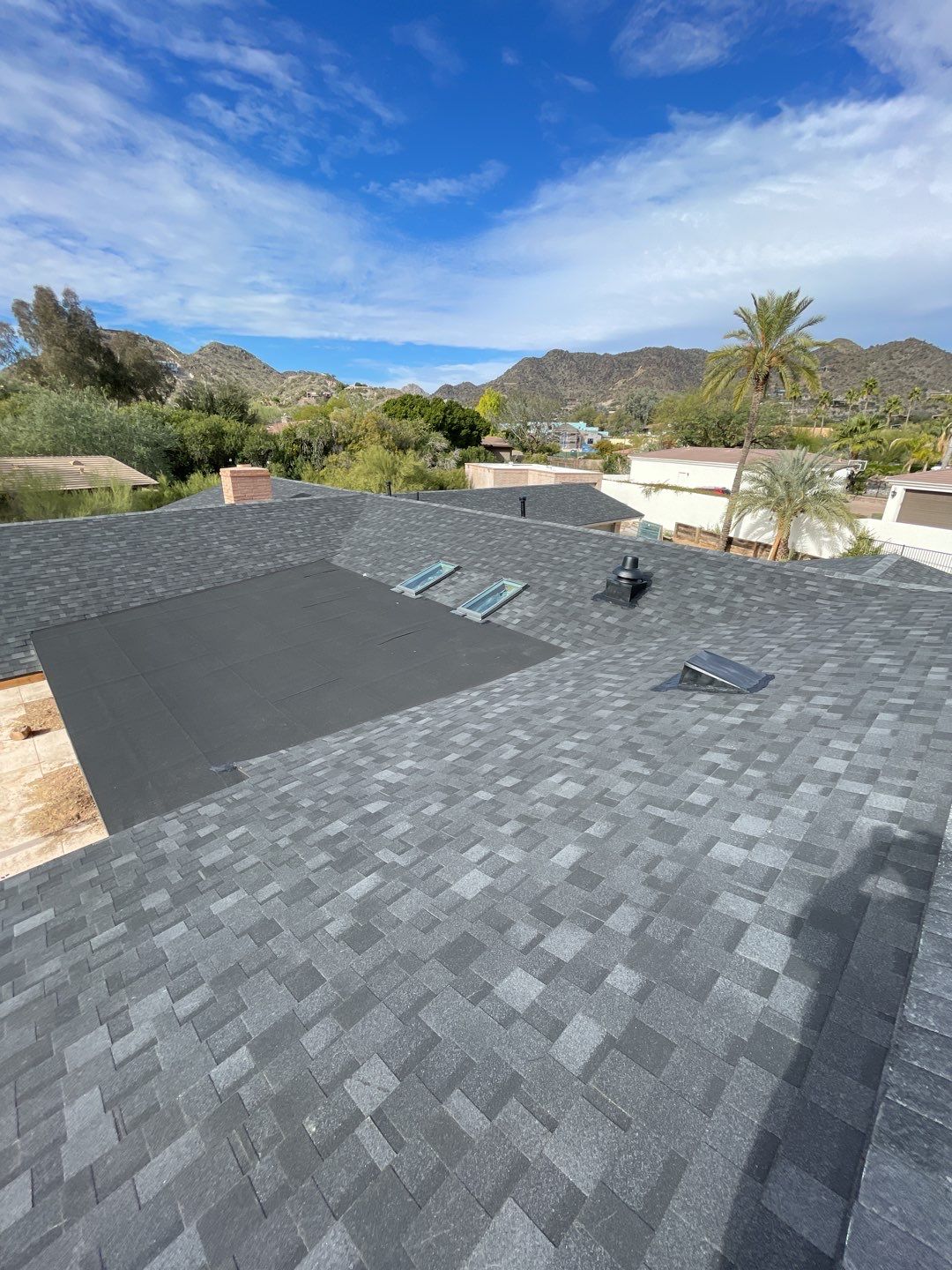 Onyx Black Shingles by Reimagine Roofing