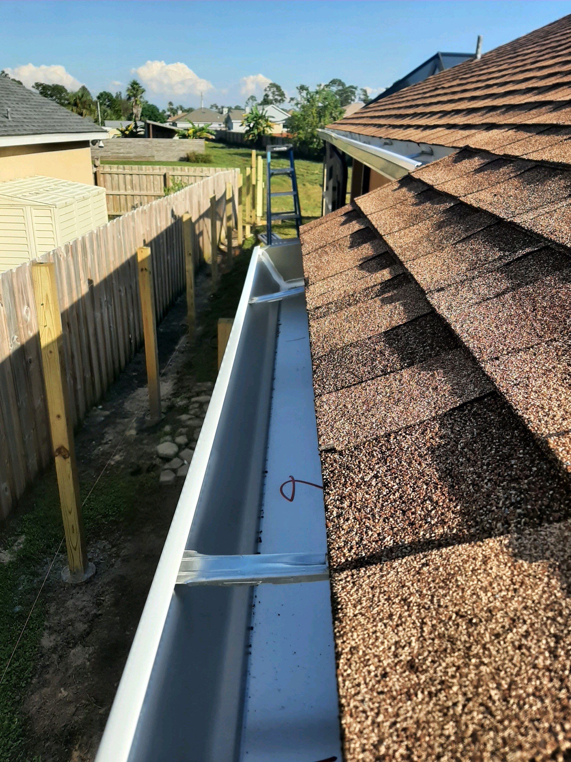 Seamless Gutter Installation using White K-Style Gutters by Gutter Professors