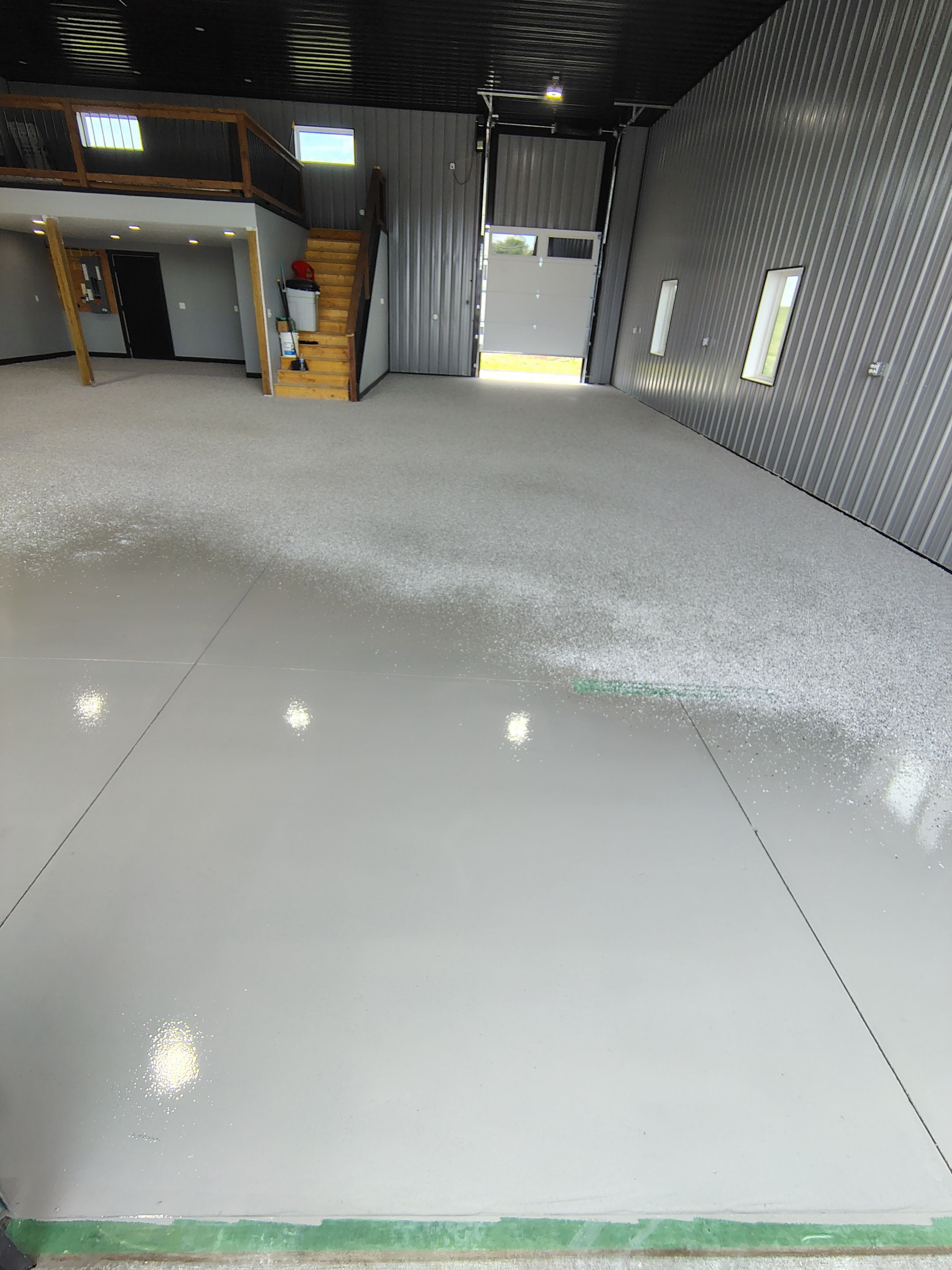 Polyaspartic Garage Floor Coating with Decorative Flake in Wentworth by Select Painting, Coatings & Garage Cabinets