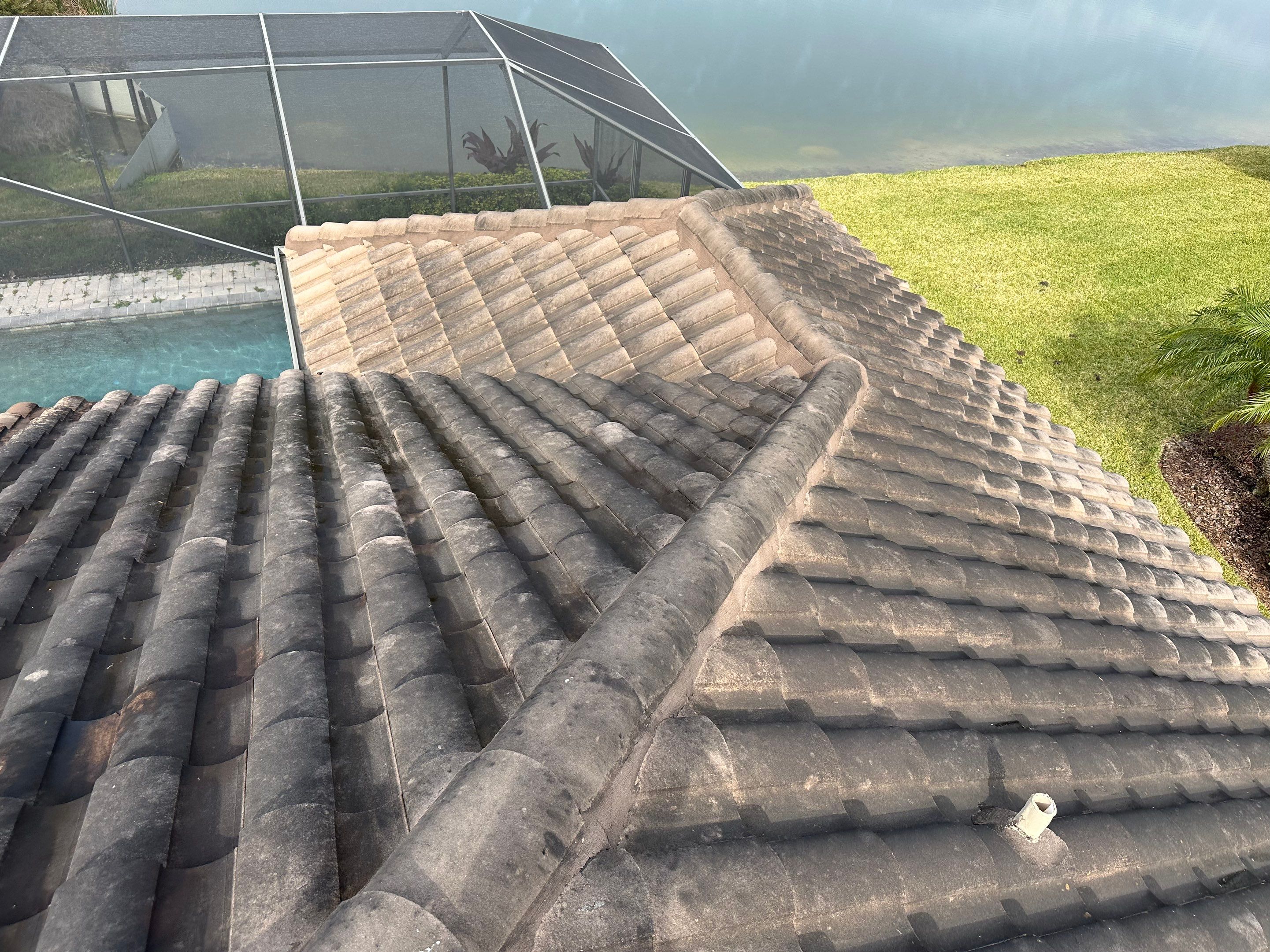 Concrete Tile Roof, Paver Pool Deck, Screen Enclosure & Driveway Cleaning in Artisan Lakes Esplanade, Palmetto, FL | Sunshine AquaWash by Sunshine AquaWash