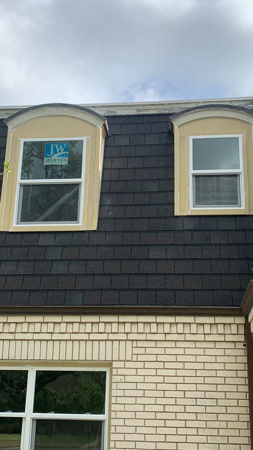 Mansard Charm by Bayfront Roofing and Construction