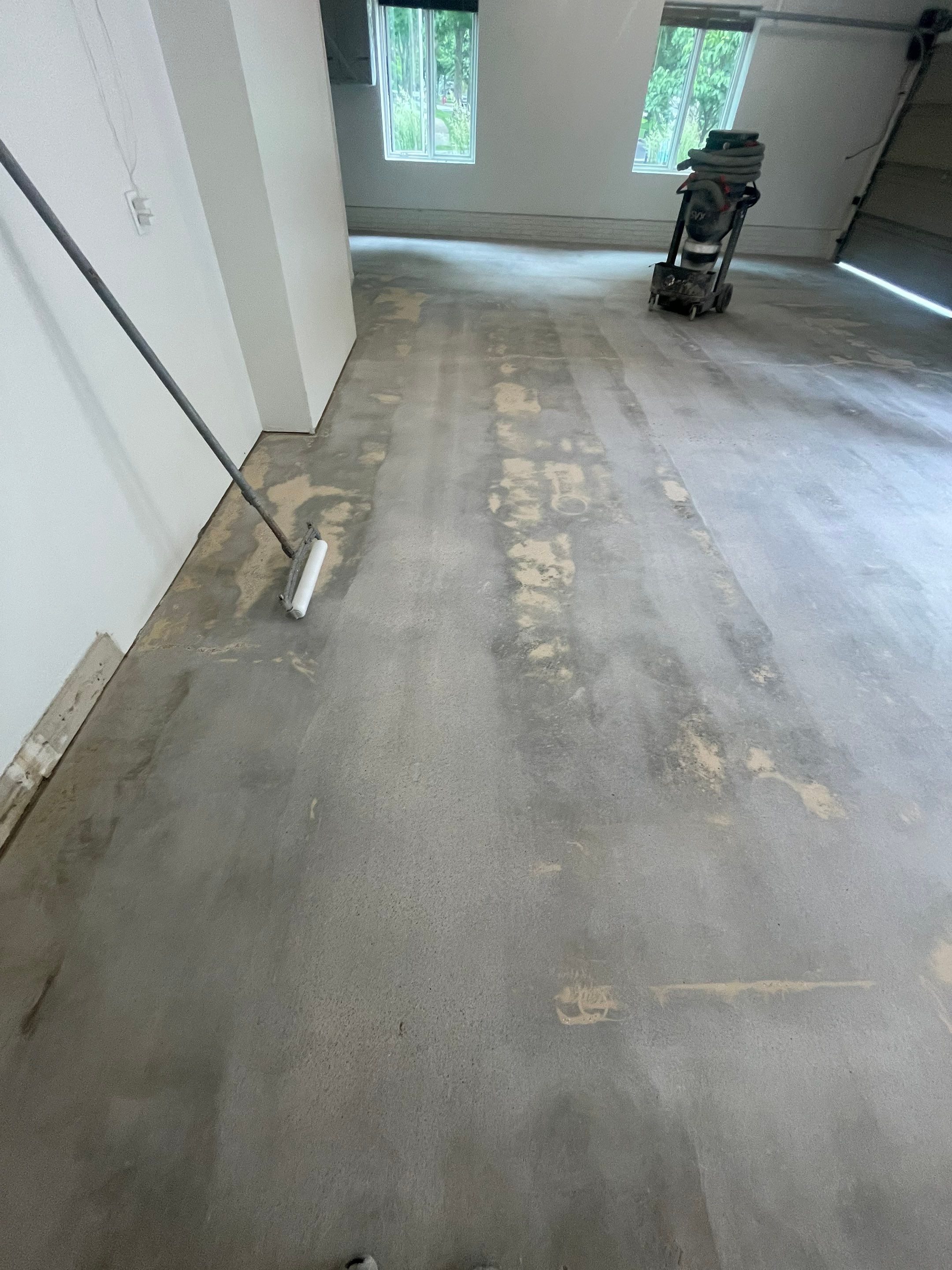Gray Speckled Epoxy Garage Floor Coating in Sioux Falls by Select Painting, Coatings & Garage Cabinets
