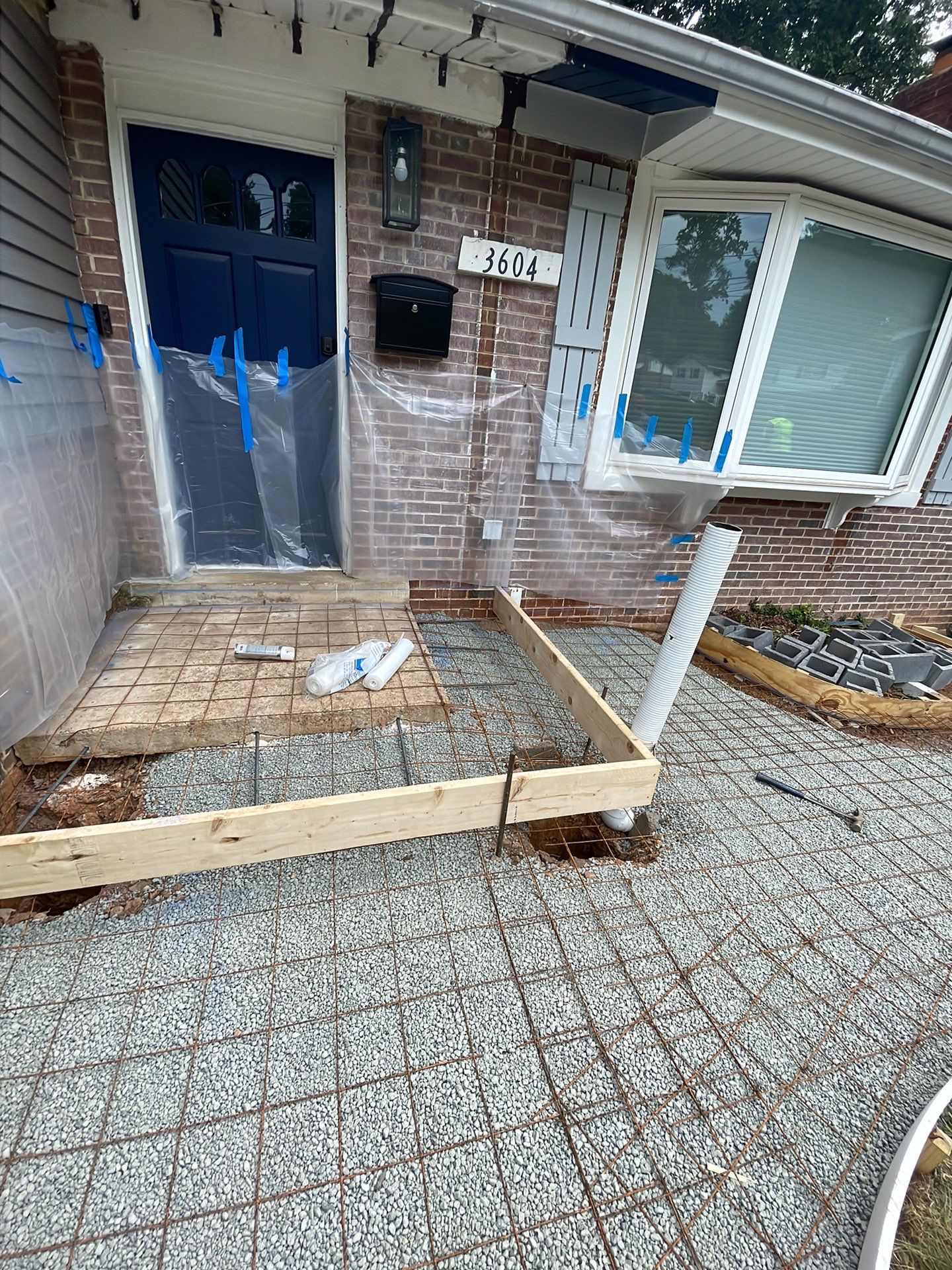 New walkway with stairs and a new front porch by Fairfax Contractors, LLC
