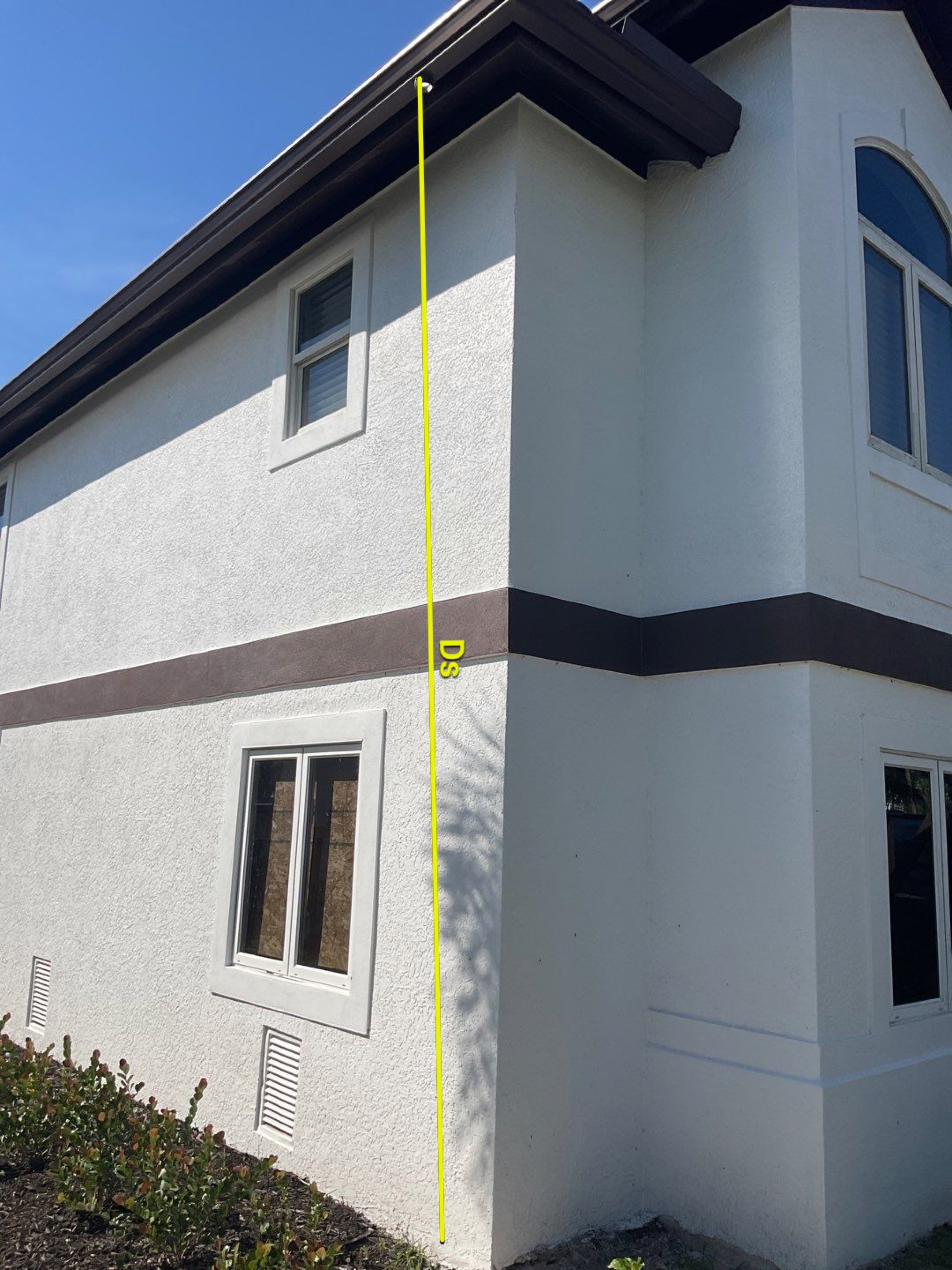 Musket Brown 7-Inch Gutters and White Down Spouts in Sanibel FL by Gutter Professors