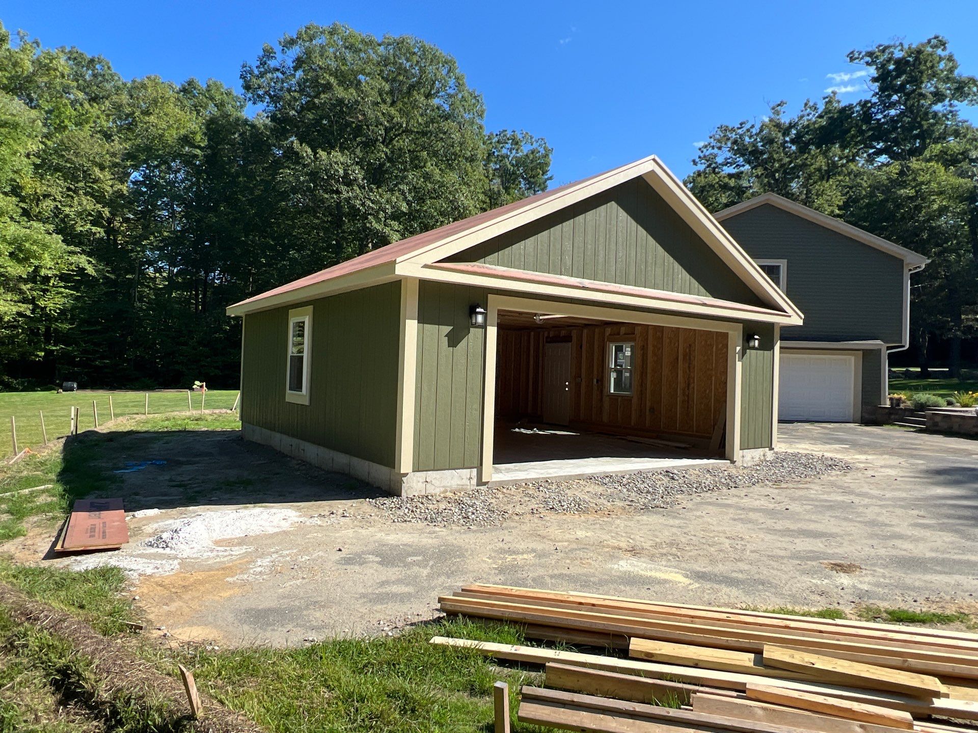Two-Car Garage using LP SmartSide Panel Siding by Chagnon Building & Remodeling LLC