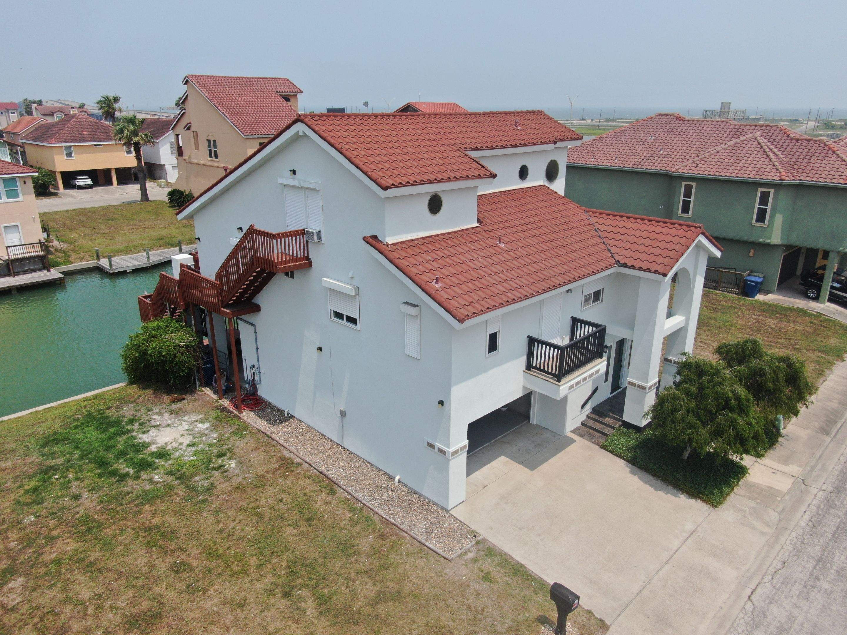 Waterfront Stucco Remastered by Bayfront Roofing and Construction