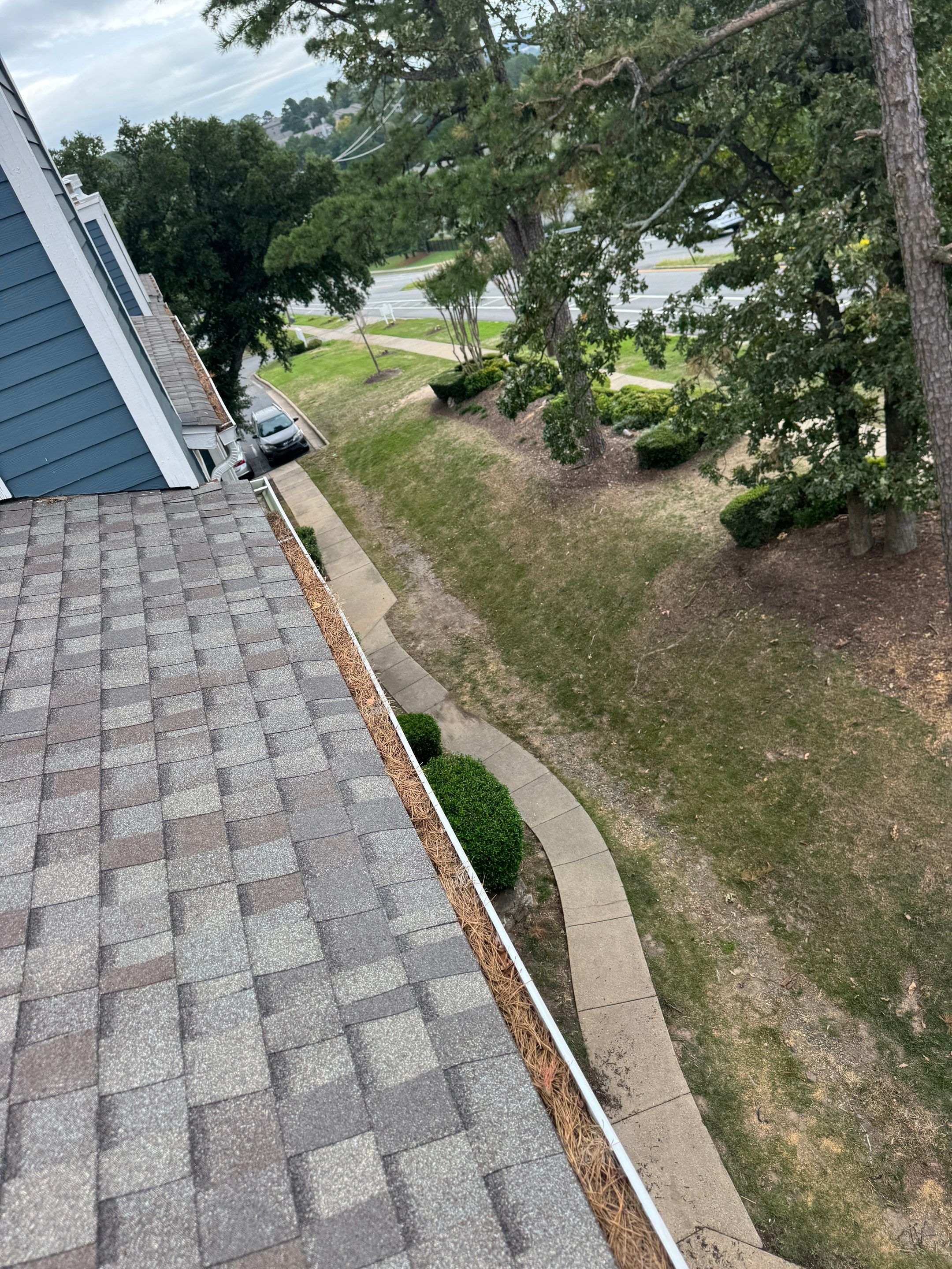 Commercial gutter cleaning Little Rock, AR before photo with filled gutters