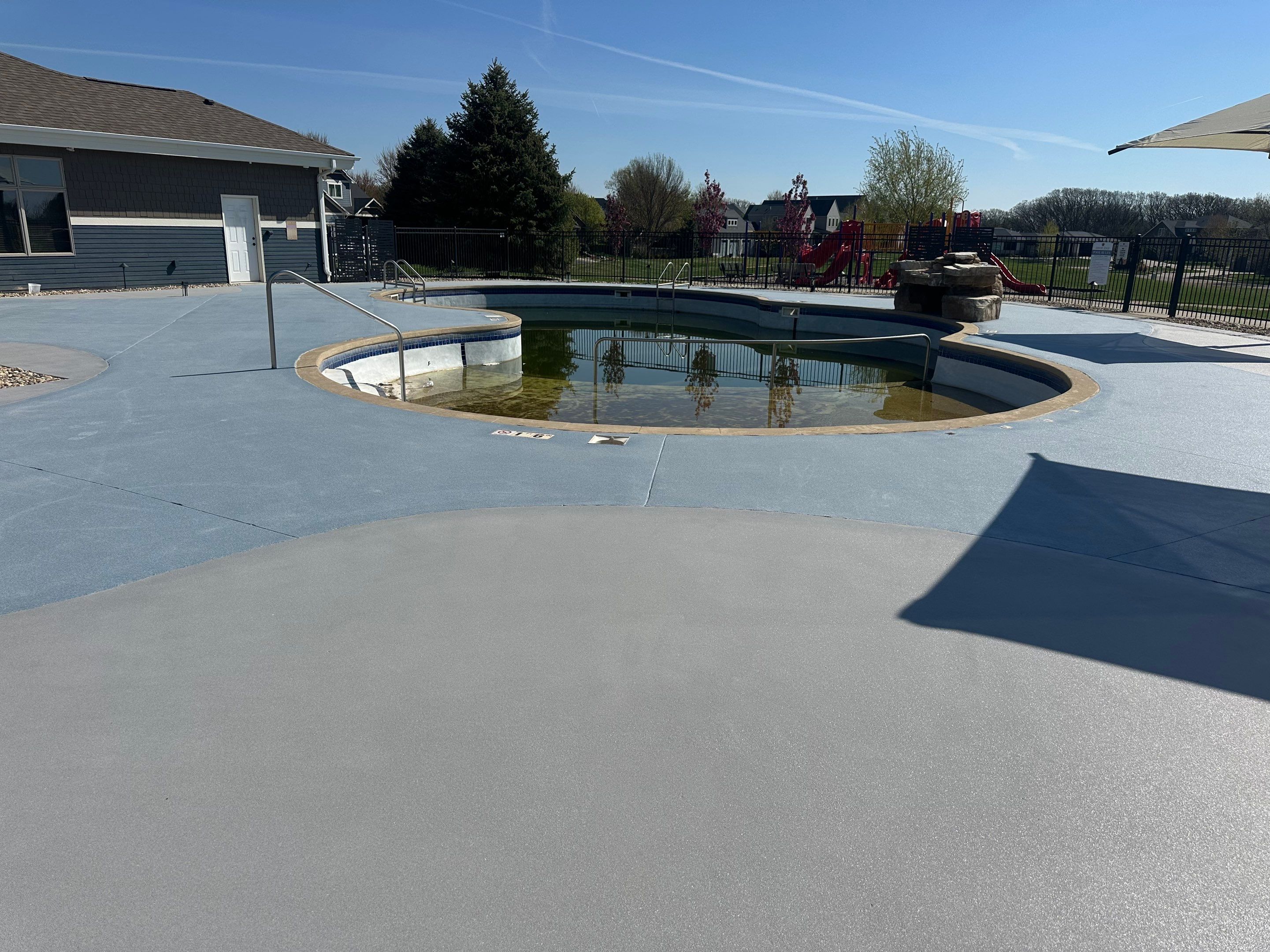 Arbors Edge Pool Deck Restoration and Textured Concrete Coating by Select Painting, Coatings & Garage Cabinets