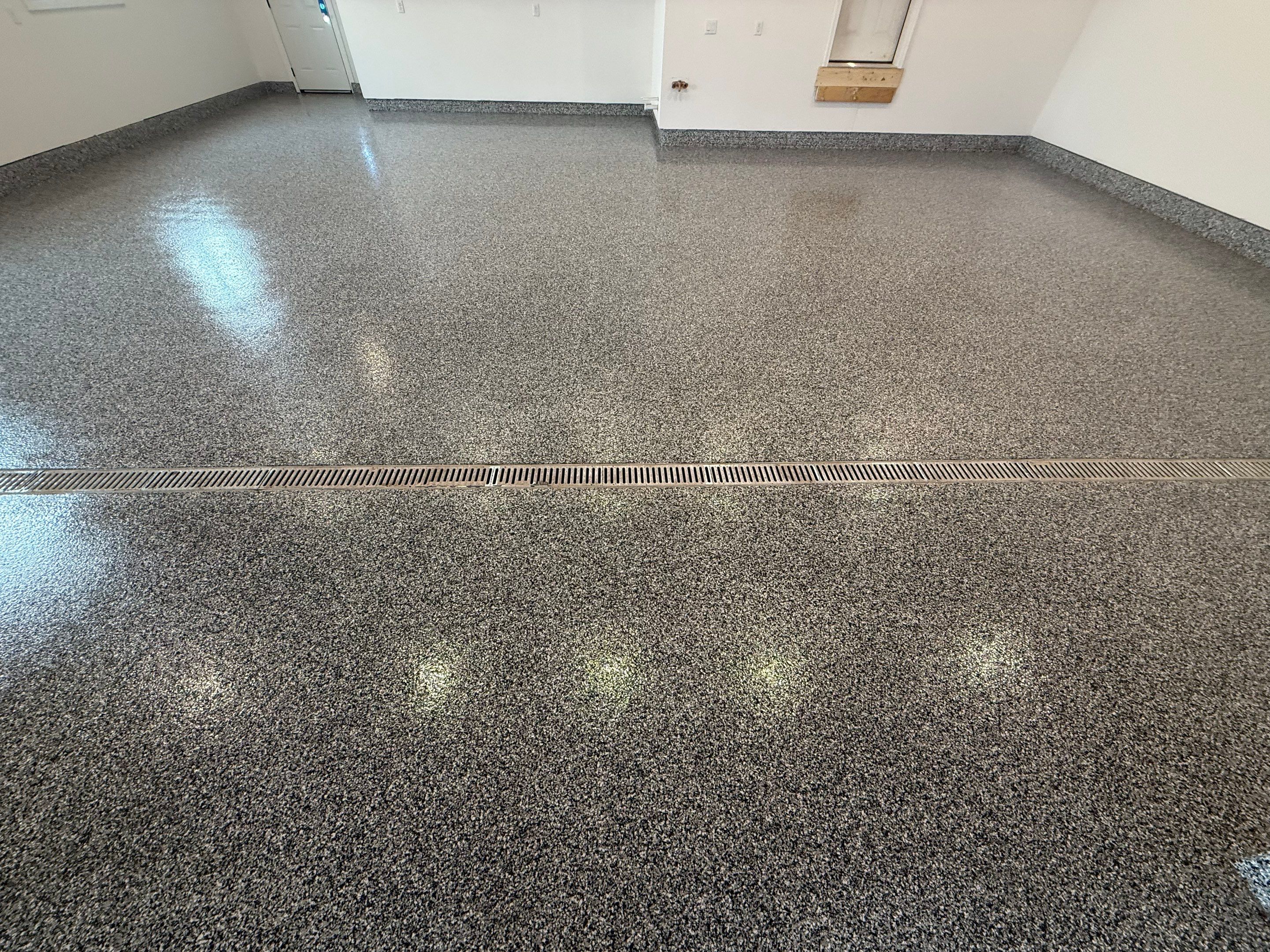 Multi-Car Garage Epoxy Floor Coating and Concrete Finishing in Sioux Falls by Select Painting, Coatings & Garage Cabinets