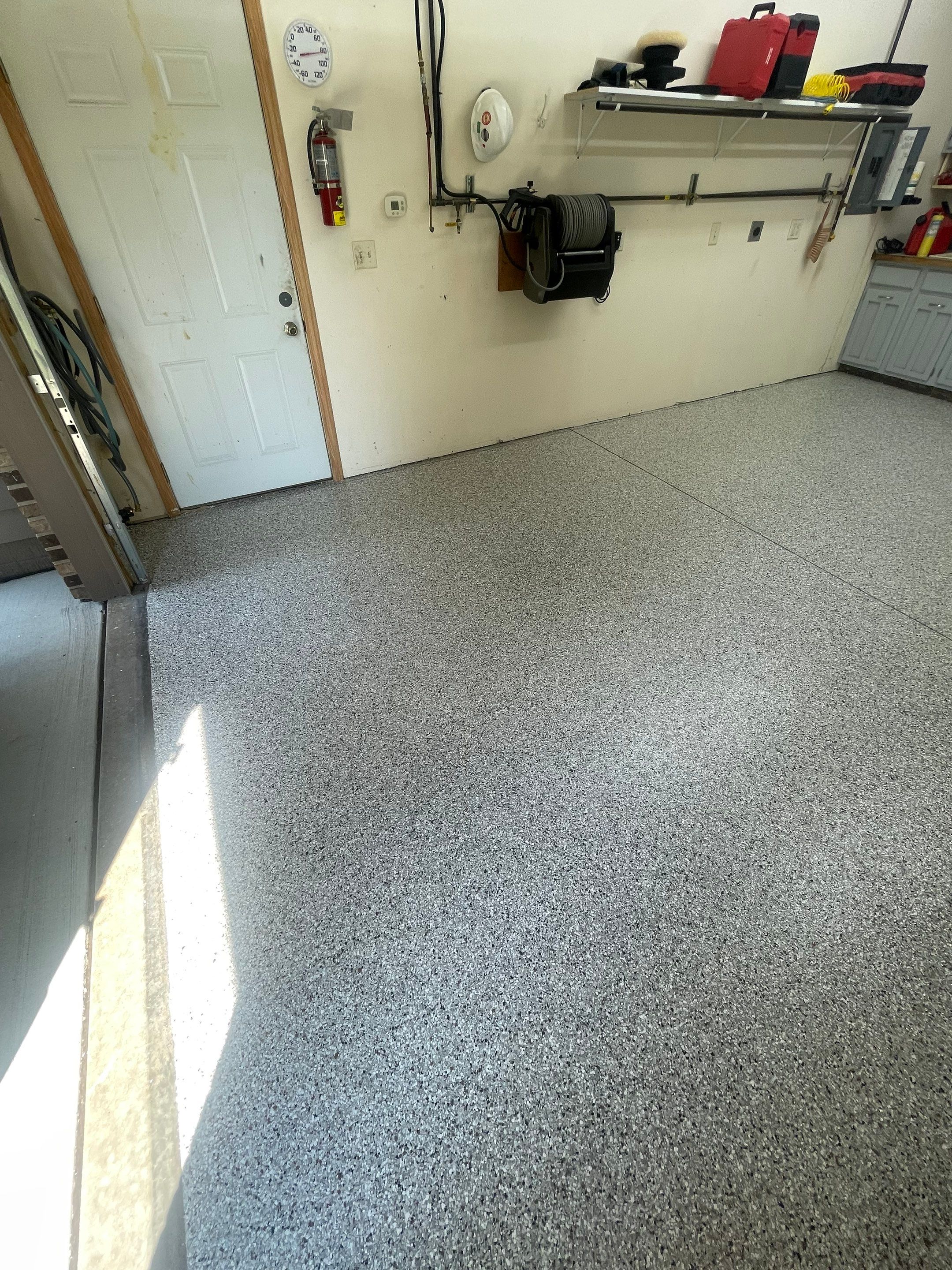 Multi-Stall Garage Floor Coating Installation in Sioux Falls by Select Painting, Coatings & Garage Cabinets