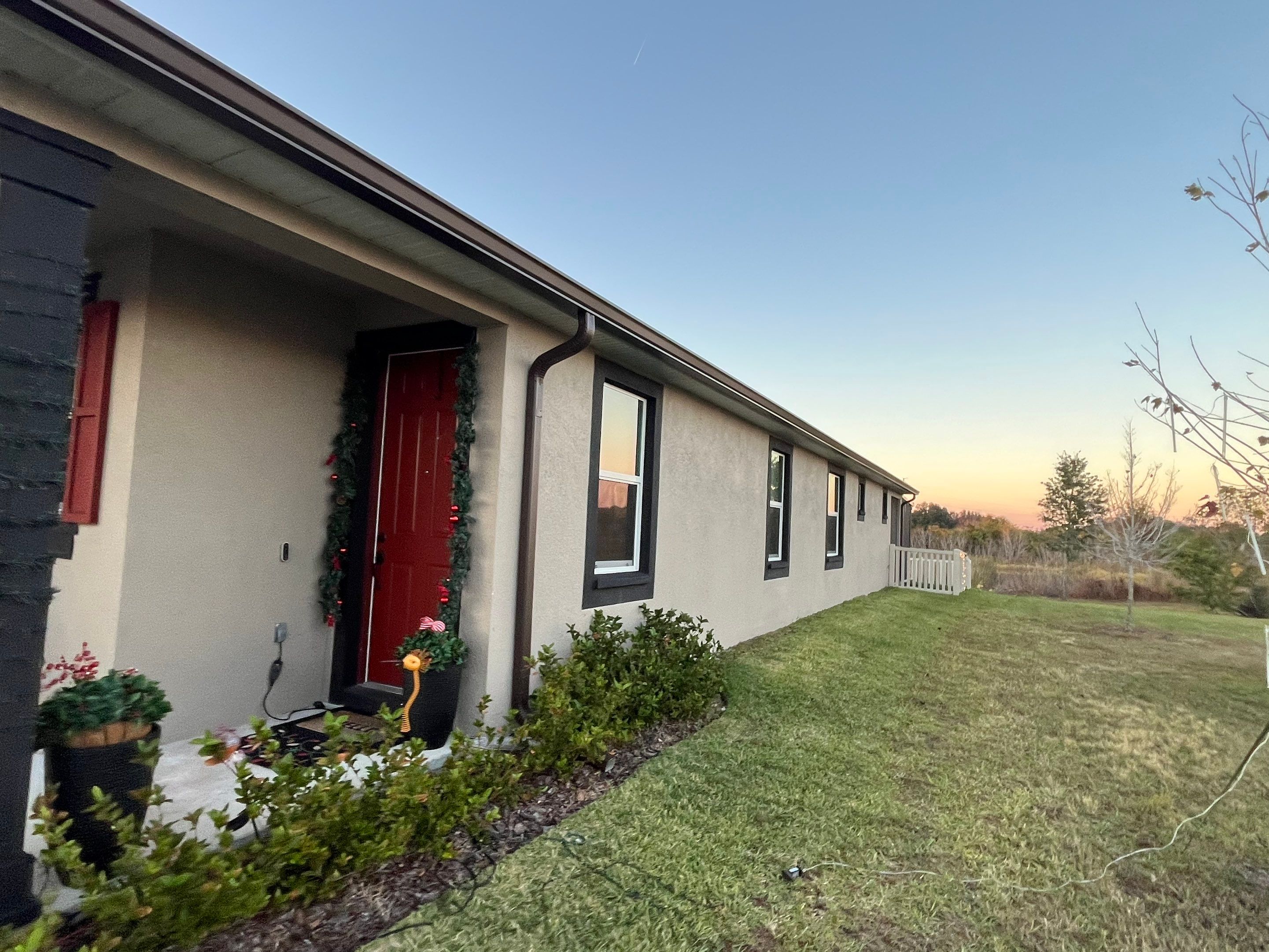 3X4 elbow Downspouts using Musket Brown Seamless Gutters in Lakeland FL by Gutter Professors