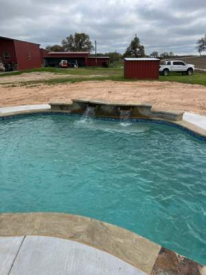 Freeform Pool with Raised Spa and Spillway