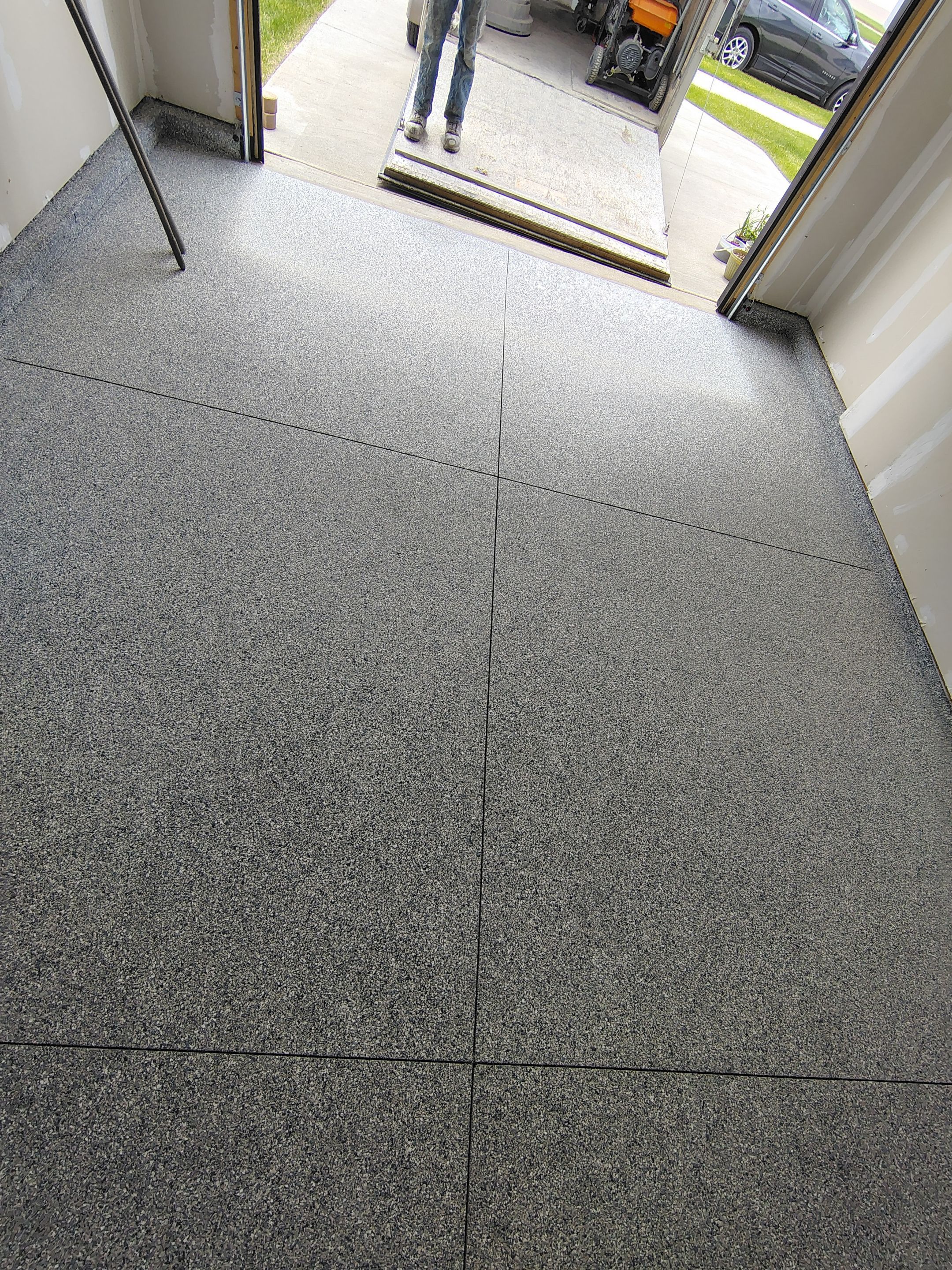 Custom Epoxy Garage Floor Coating Installation in Sioux Falls by Select Painting, Coatings & Garage Cabinets