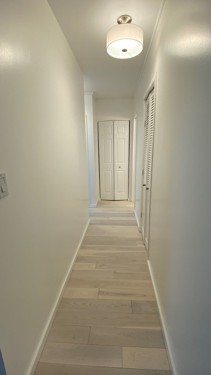 Apartament renovation  using Harwood floor  by Jesus Master Handyman LLC 