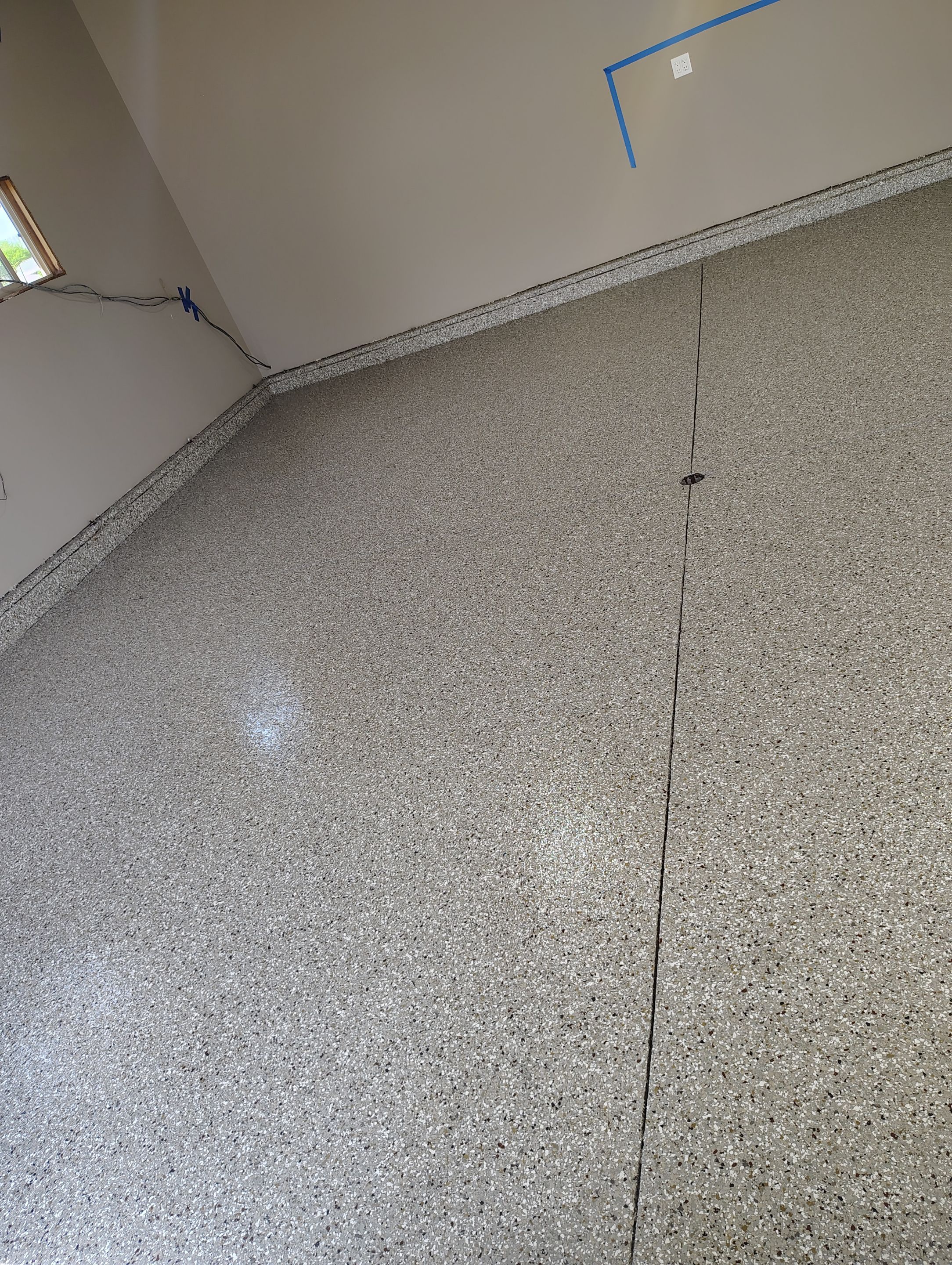 Sioux Falls Garage Concrete Repair and Epoxy Flake Floor Coating by Select Painting, Coatings & Garage Cabinets