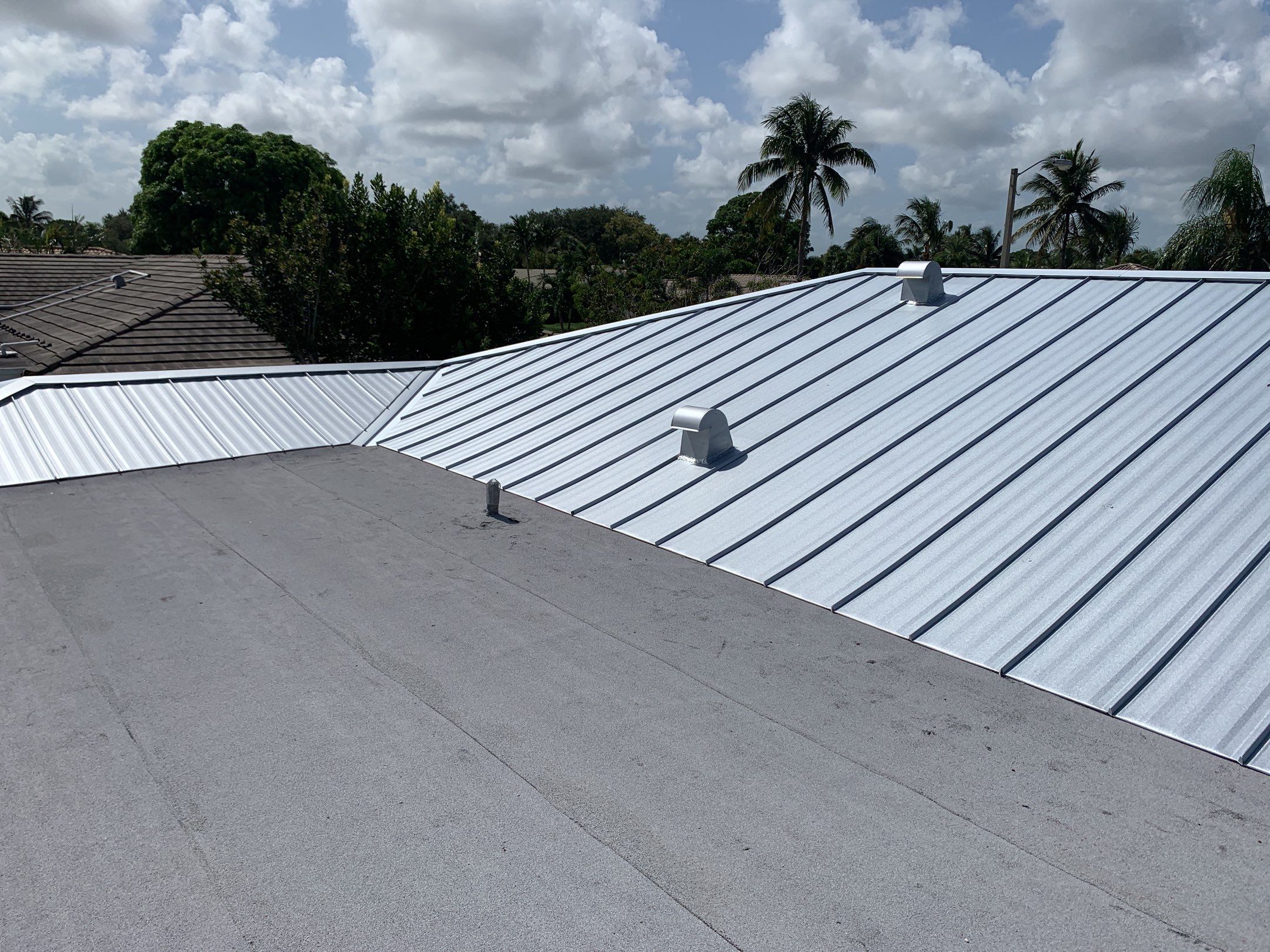 Residential Roofing Installation using 1" Nail strip metal roof by BLUES BROTHERS CONSTRUCTION CORP