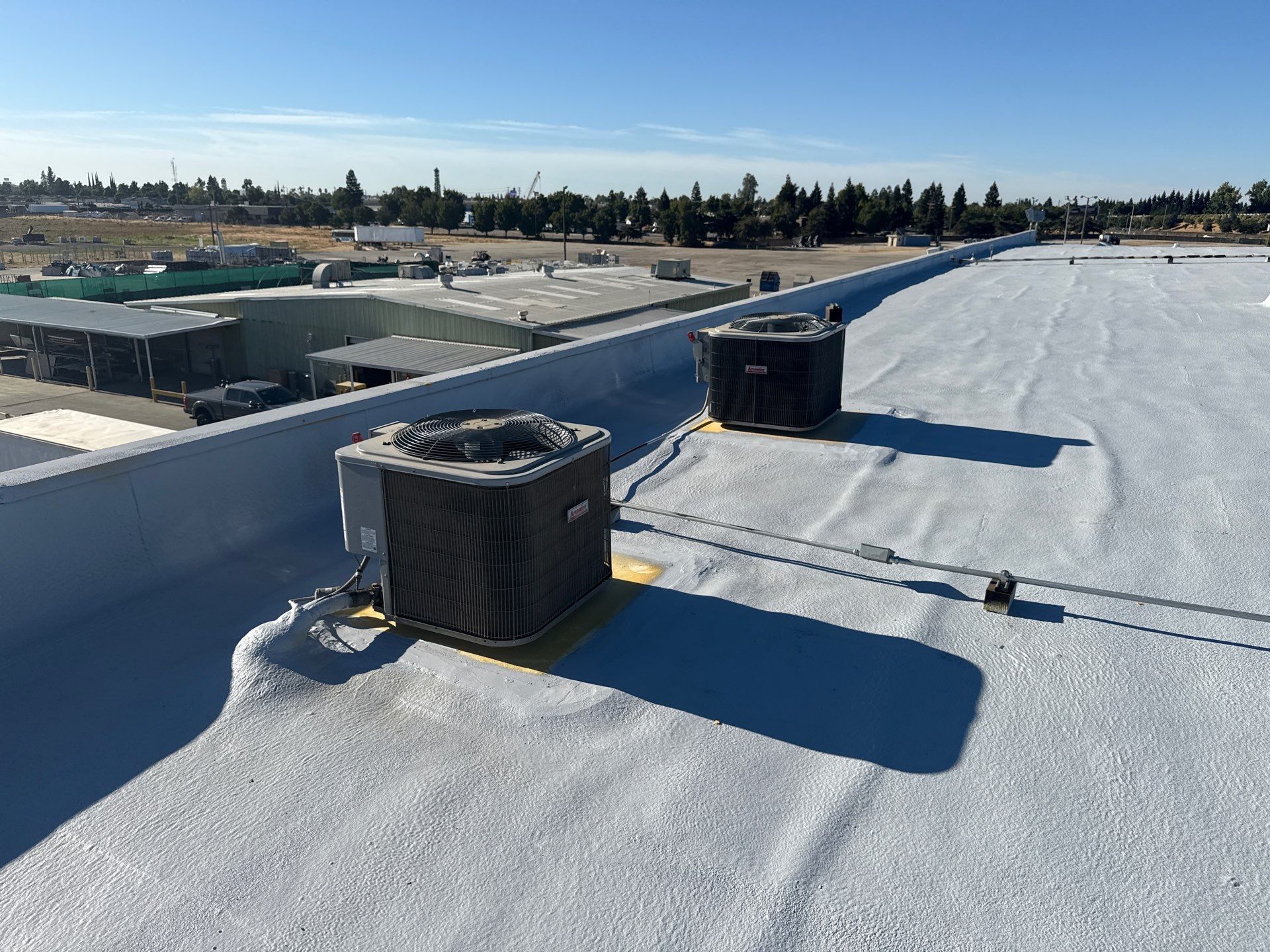 Pro Farms Spray foam roofing project by Straight Edge Roofing Inc
