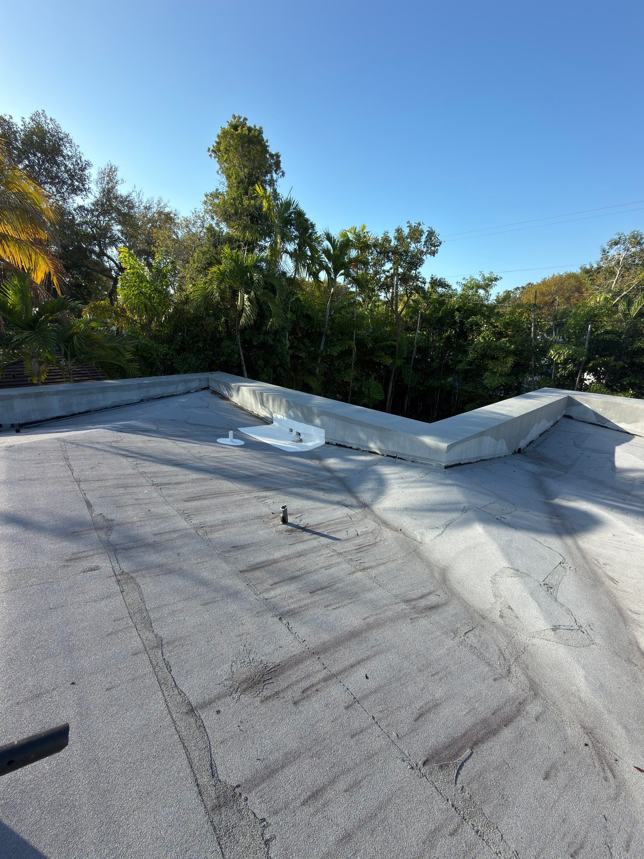 Flat Roof Silicone Coating and Interior Water Damage Restoration in Miami by Picos Construction Engineering