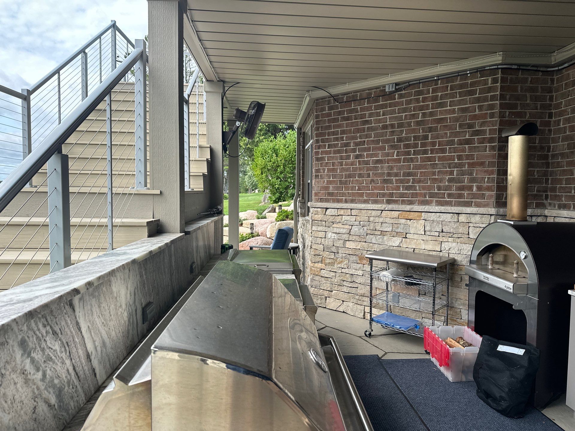Custom Underdecking System and Outdoor Kitchen in East Jordan by Rainbow Seamless Systems
