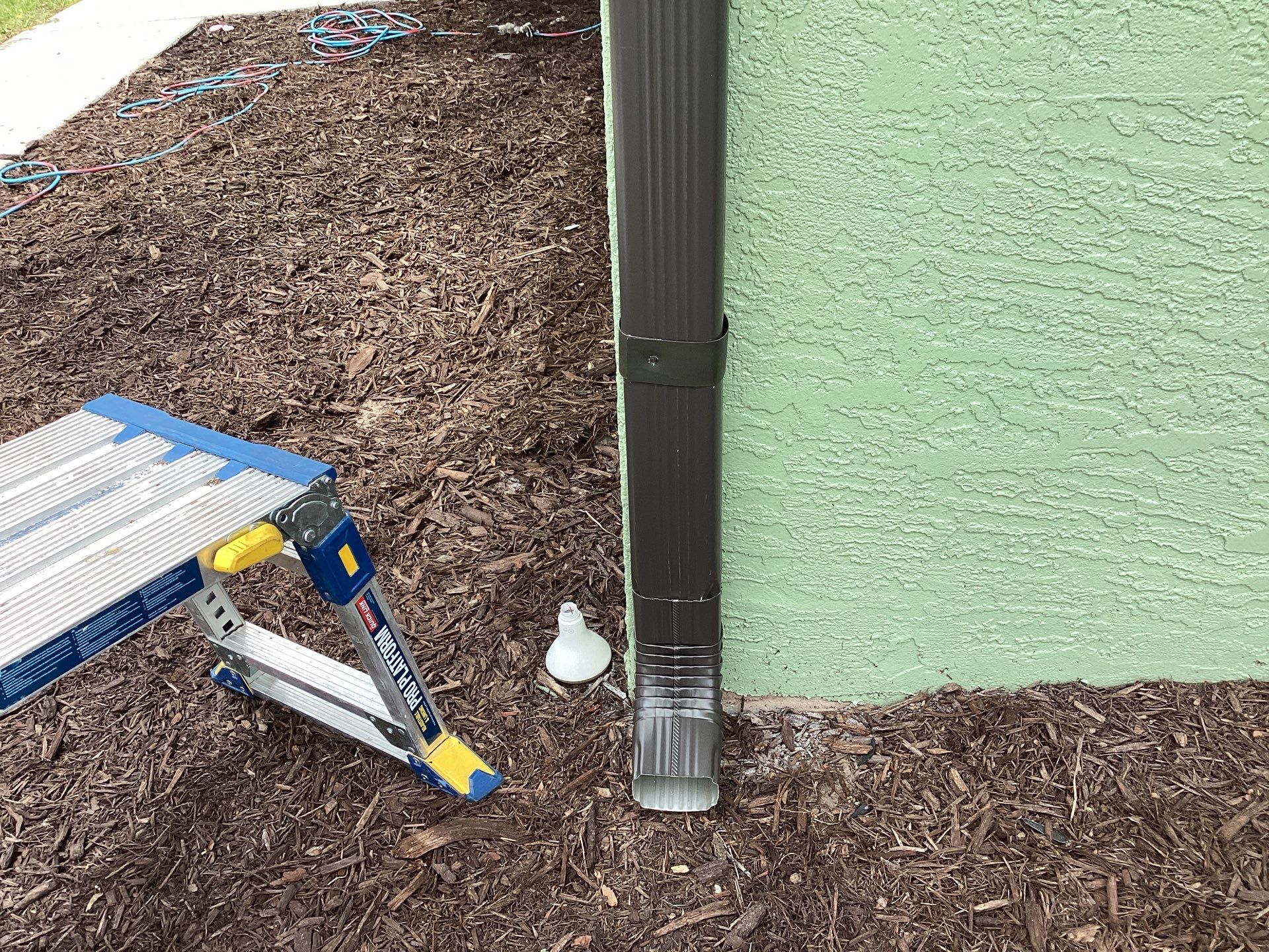 Musket brown downspouts with 6-inch K-Style gutter installation in Myakka City, FL by Gutter Professors