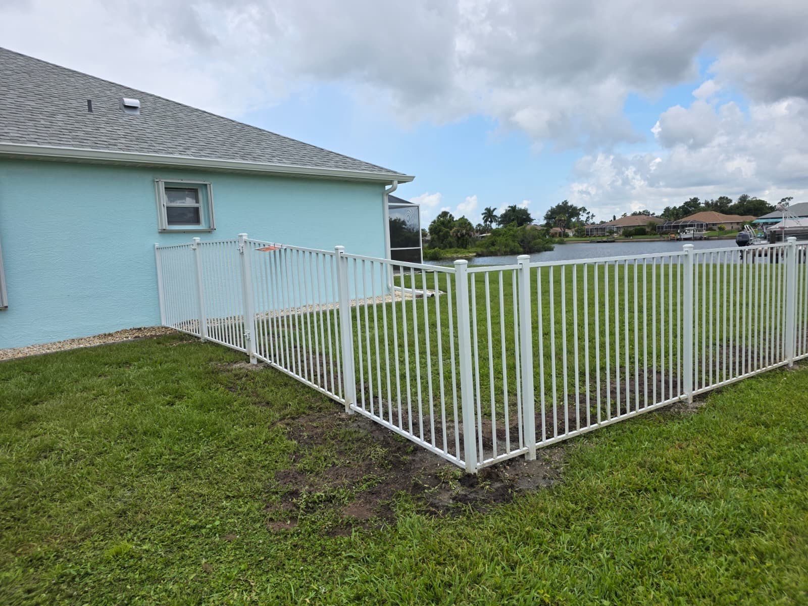 White Aluminum Picket Fence Installation for Port Charlotte Waterfront Home by True Fence LLC