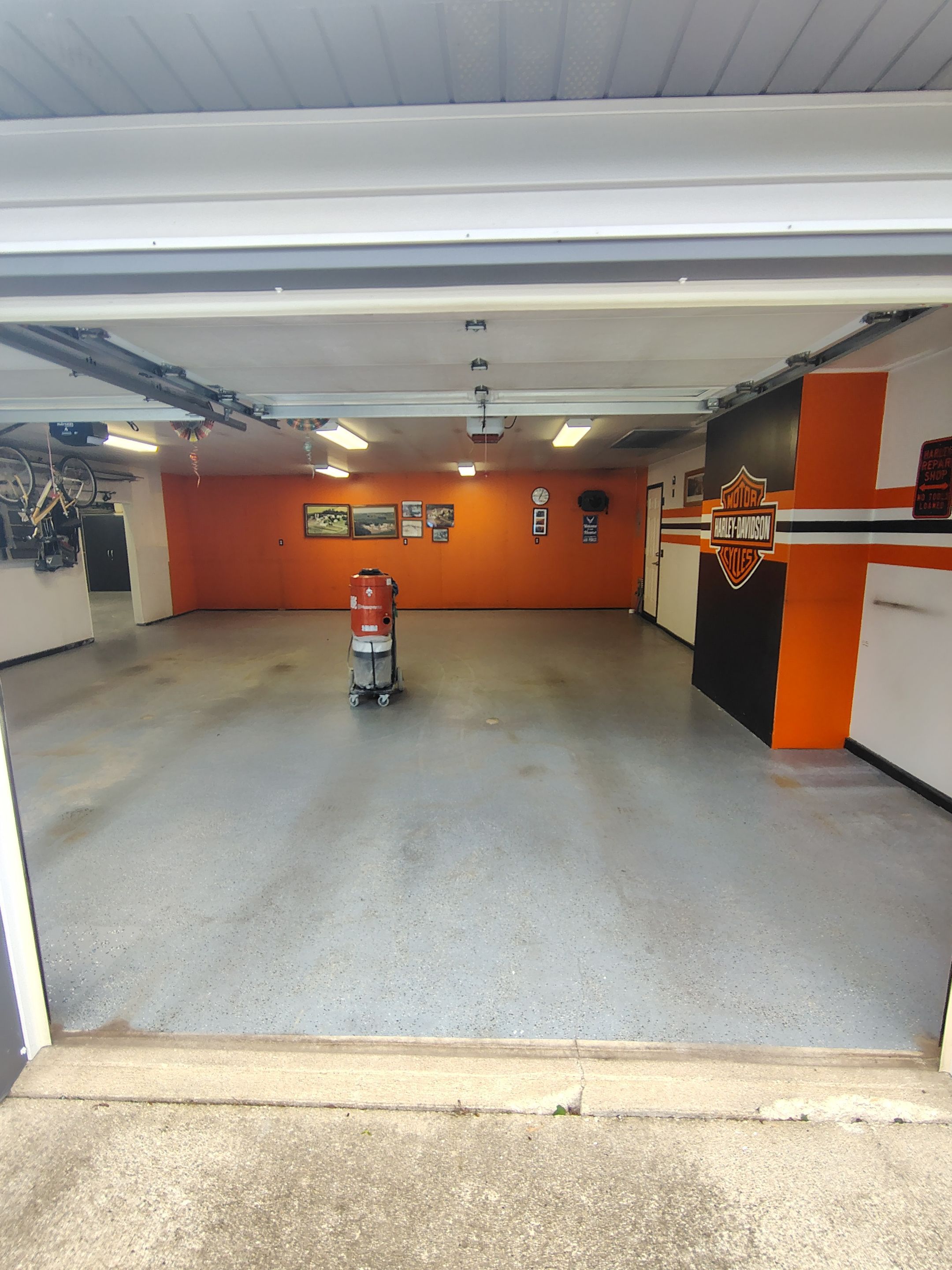 Custom Grey Flake Epoxy Garage Floor Installation in Remsen by Select Painting, Coatings & Garage Cabinets