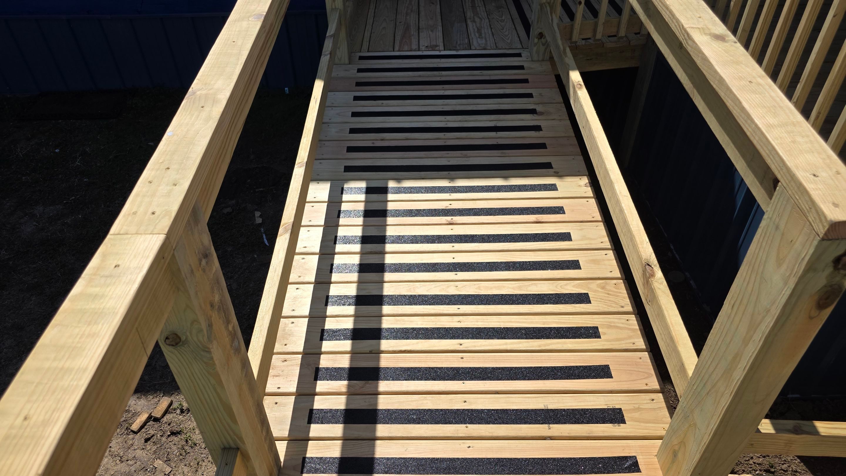 Covered Deck w/ ADA Ramp by In & Out Construction & Remodeling, LLC