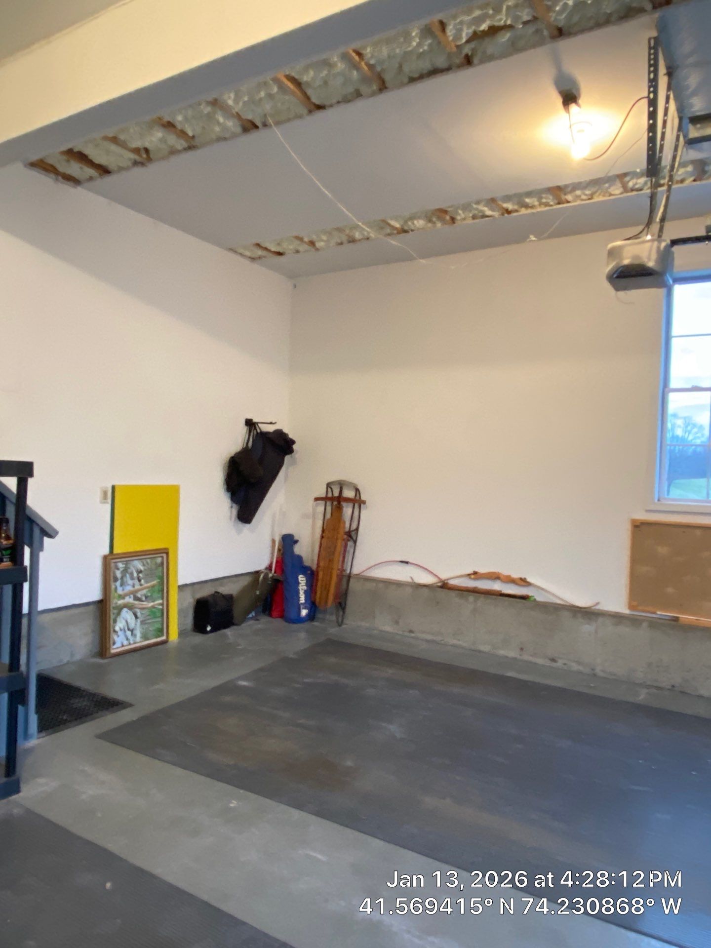 Garage ceiling using open cell spray foam by NYS Foam & Energy
