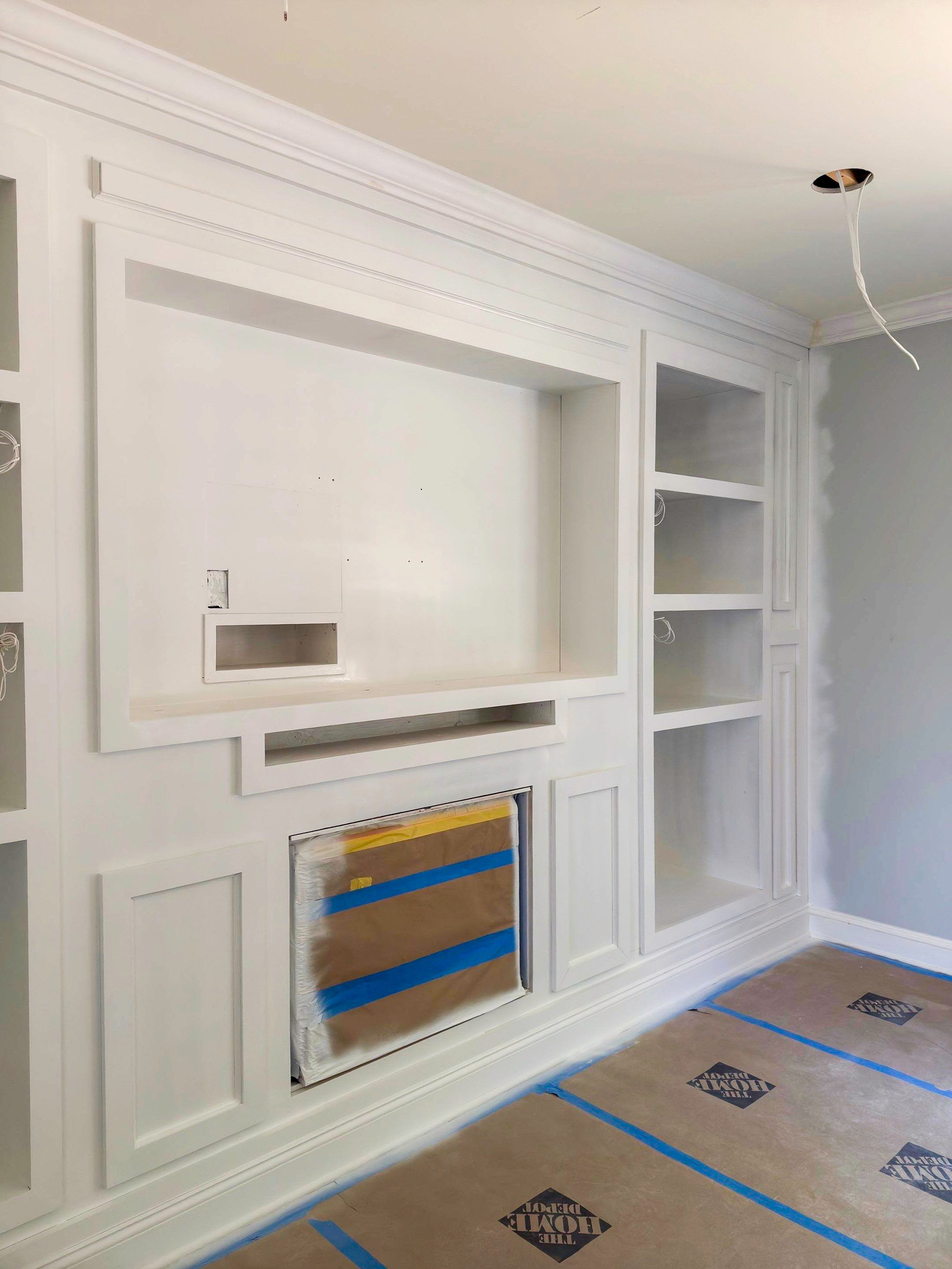 Built-in TV unit by Trendy Walls Inc.