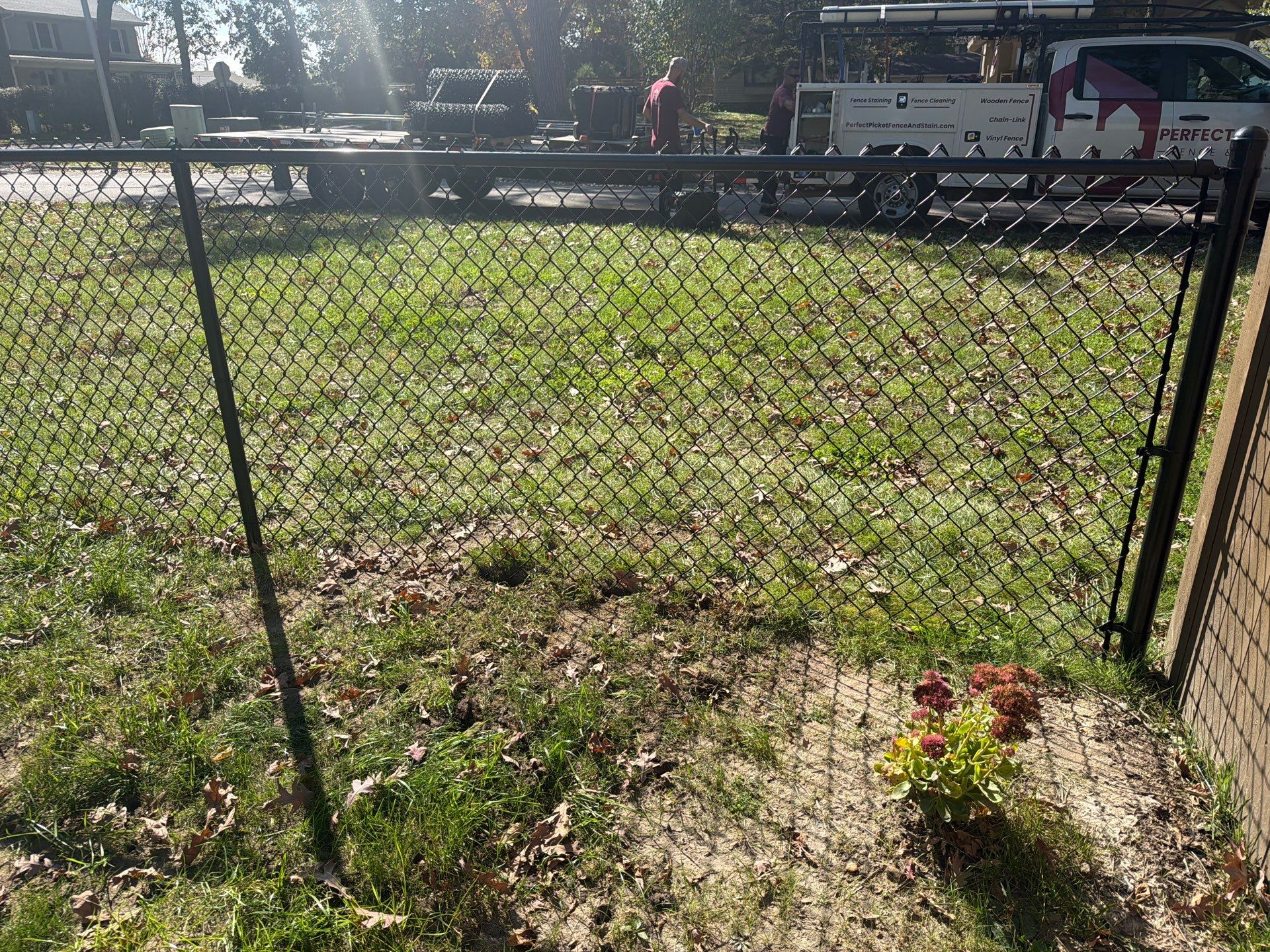 Residential Black Chain Link Fencing in Cedar Falls by Perfect Picket Fence and Stain