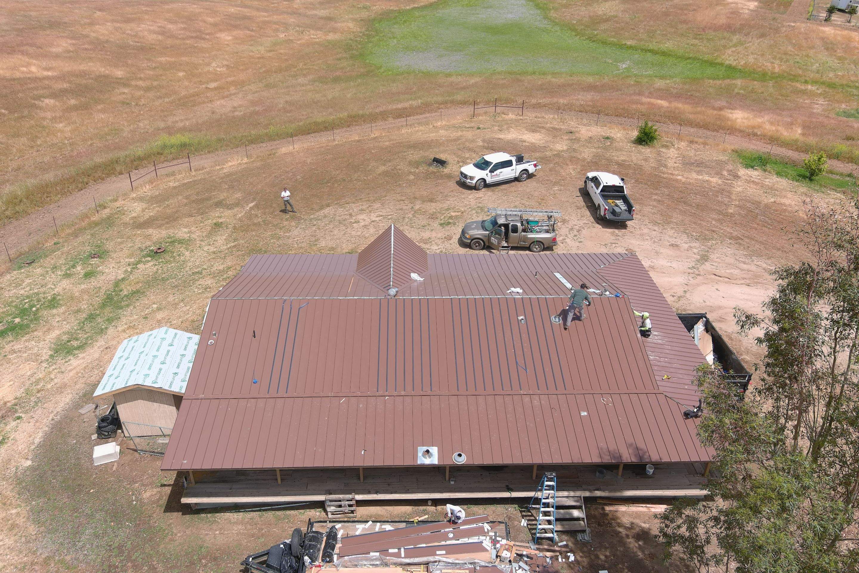 Metal roofing installation using Standing seam metal roofing system by Straight Edge Roofing Inc