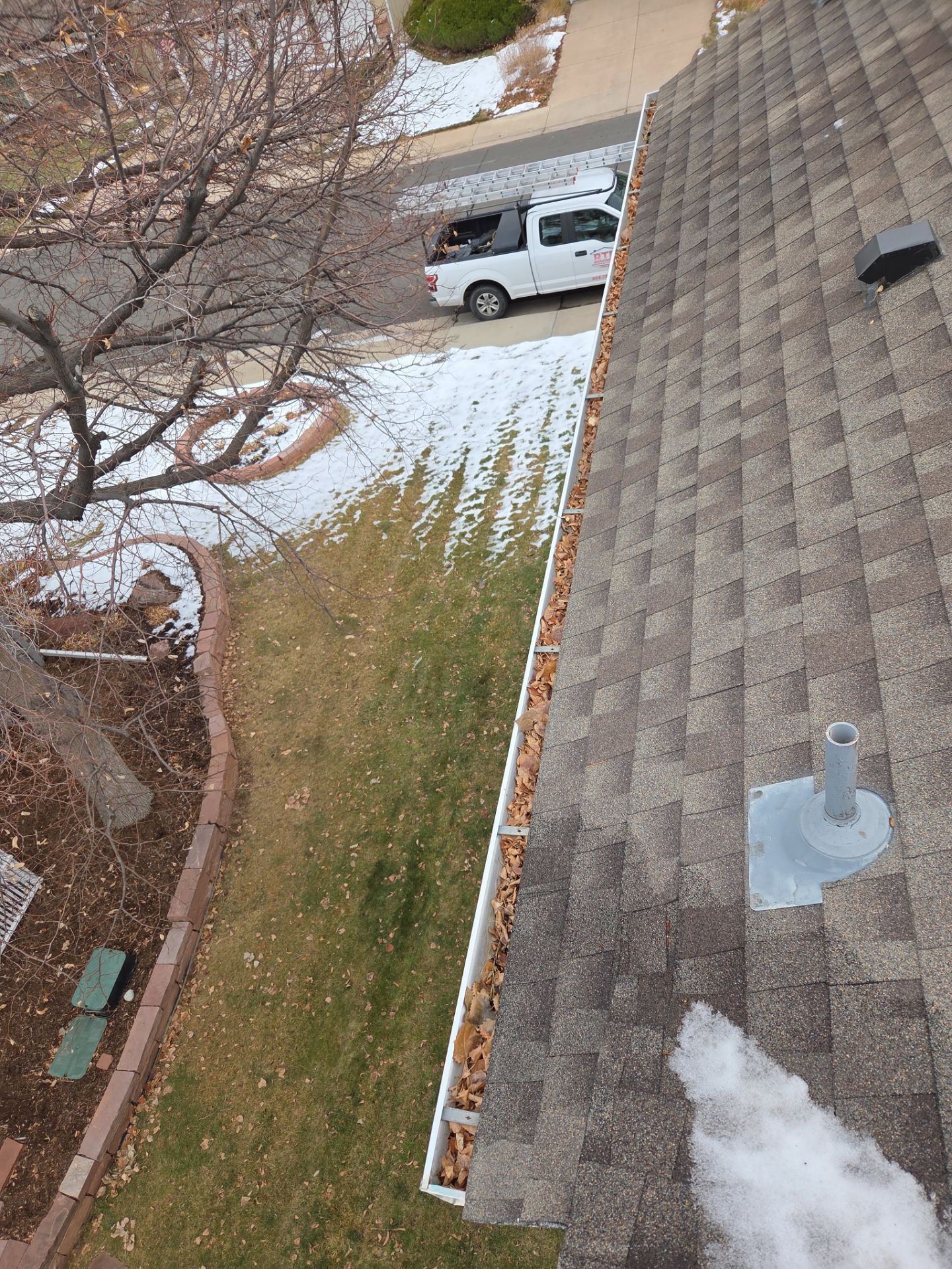Gutter and Downspout Cleaning by RTP Roofing Company
