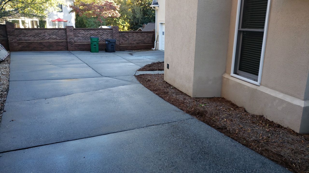Driveway Clean using cleaner by Power Wash Masters LLC