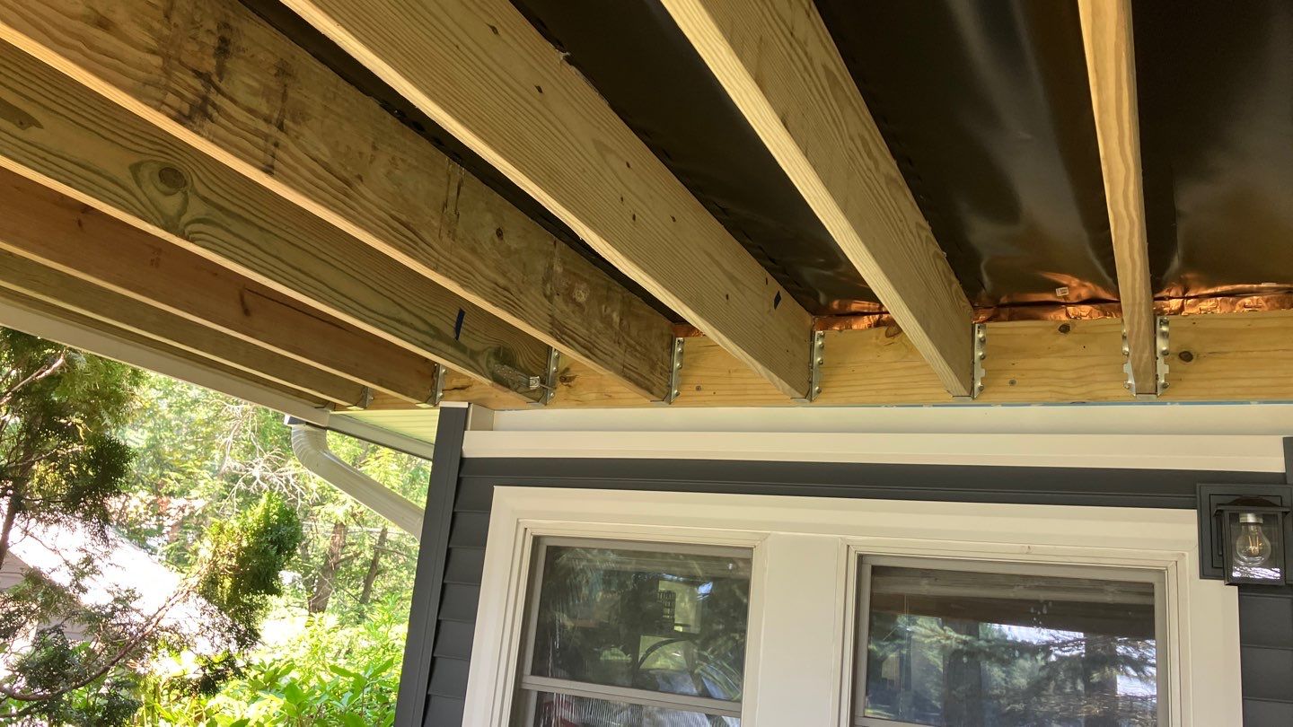 Deck replacement using Trex Transcend Rope Swing and Transcend Railings.Trex Rainescape by DiGiorgi Roofing and Siding Inc