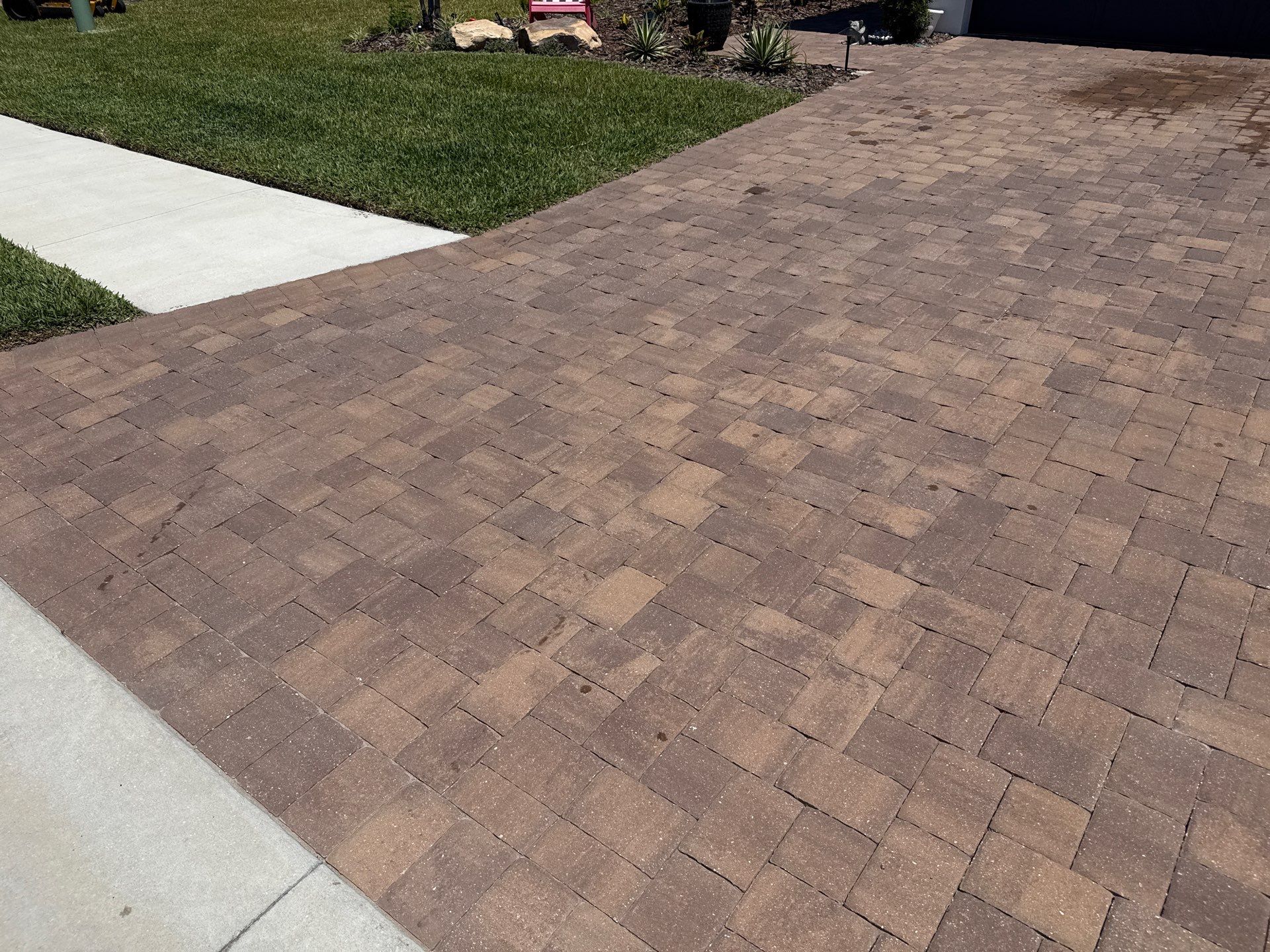 Oil Stain Removal on Paver Driveway | Esplanade at Artisan Lakes, Palmetto FL by Sunshine AquaWash