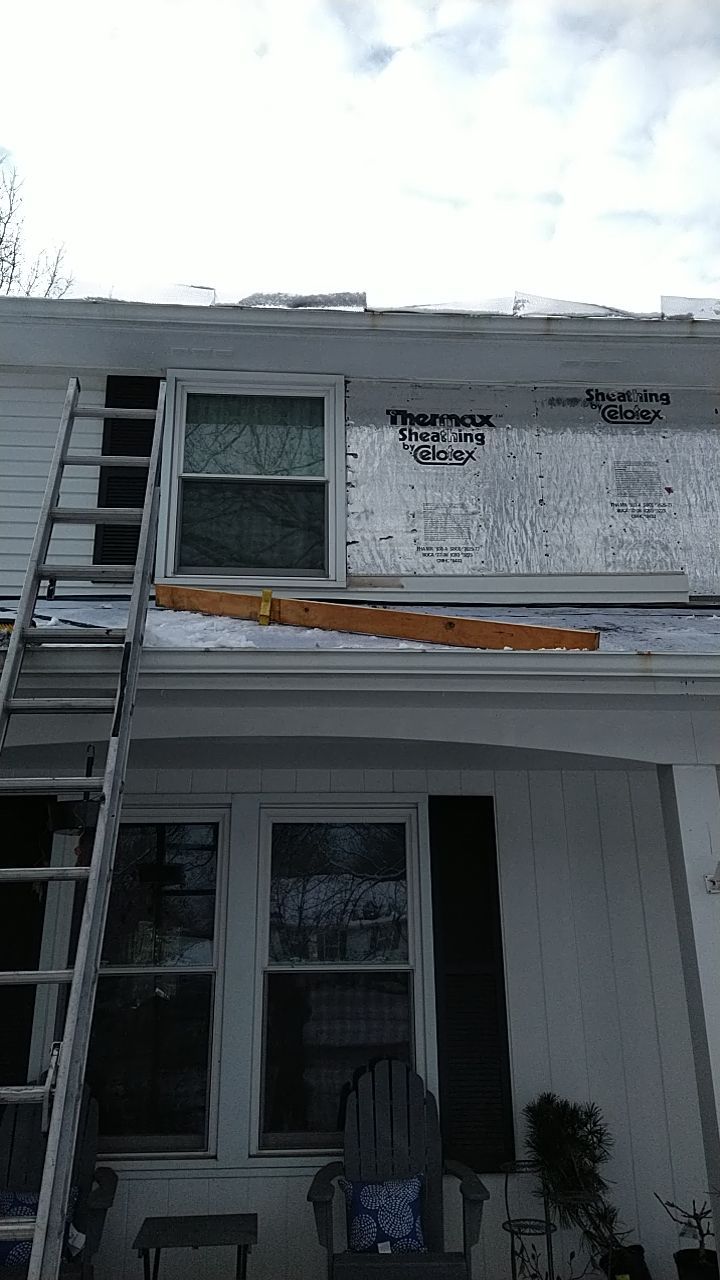 James Hardie Siding  using James Hardie Board and Batten, White by Absolute Roofing and Construction