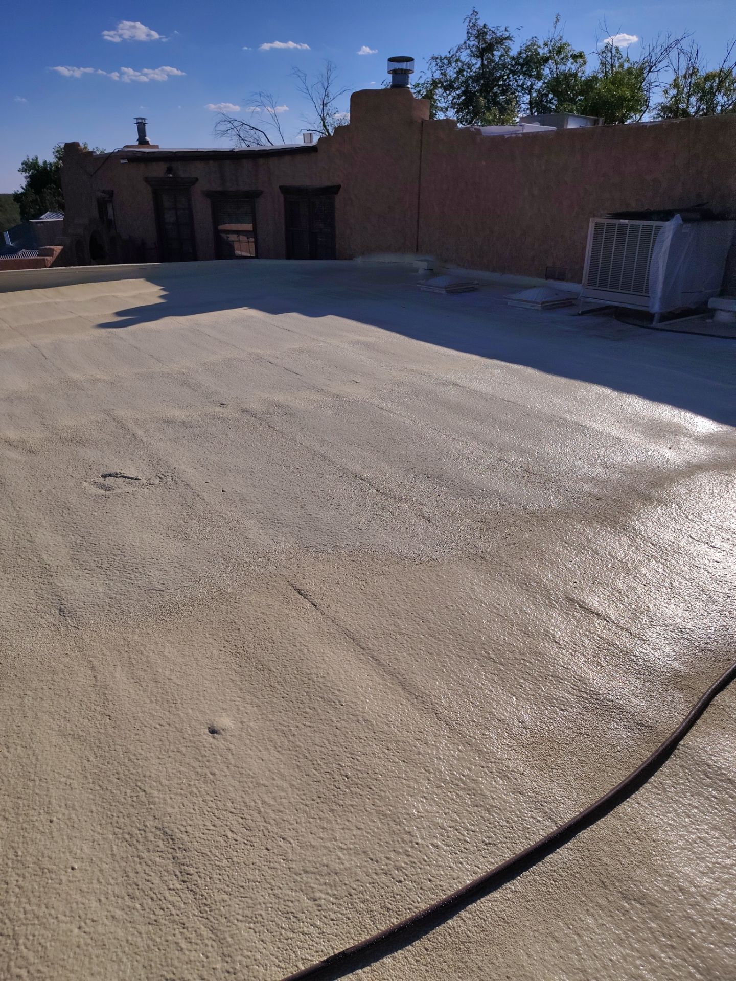 Residential roof application by SPF Services 