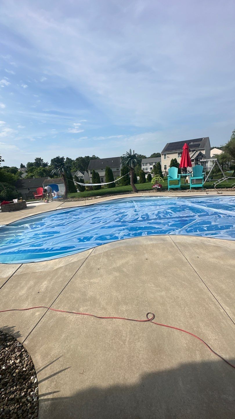 Twilight Pool Deck / Patio Project in Beaver falls by Floors in a Day, Inc