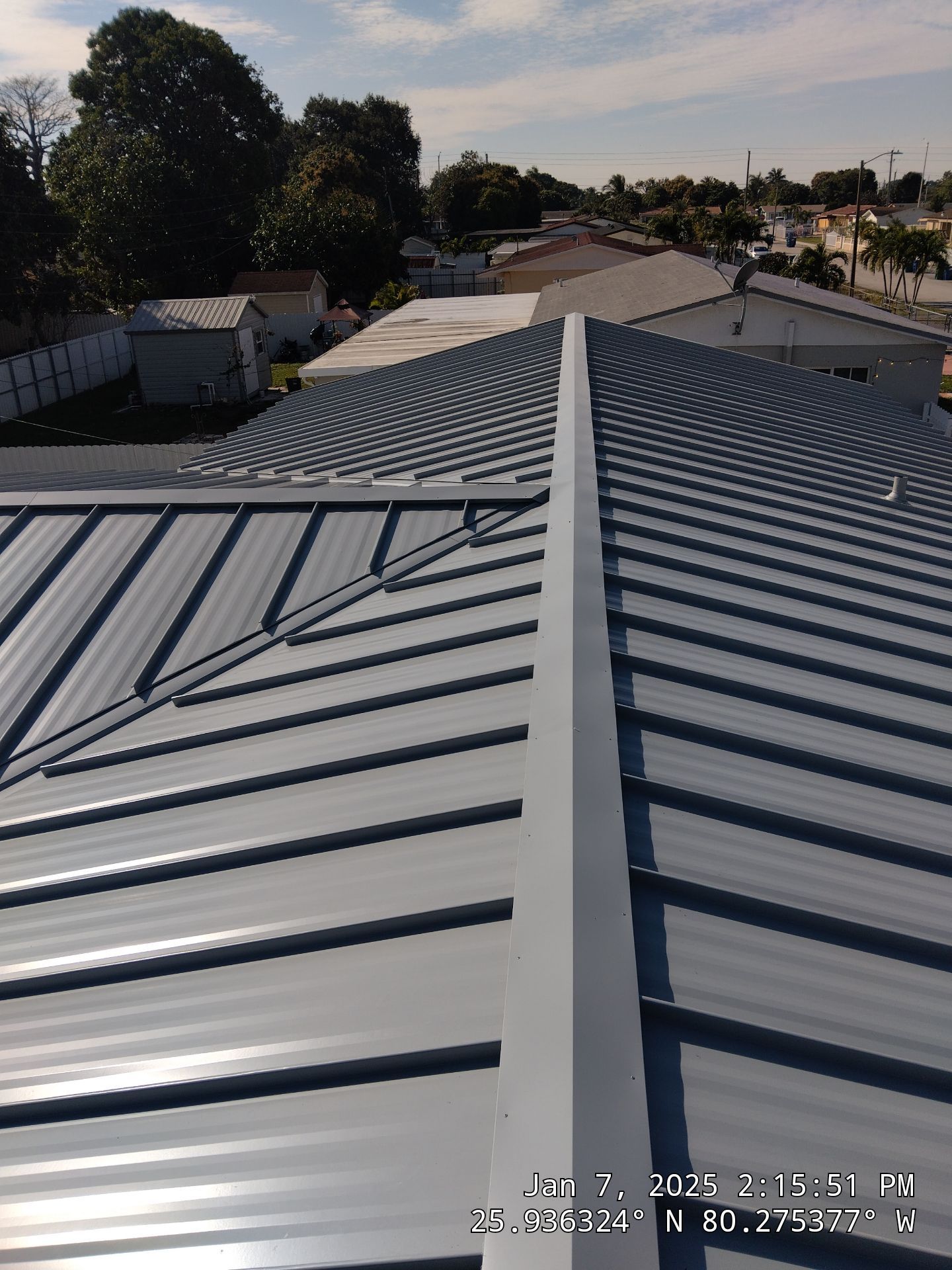 RESIDENTAL METAL REROOF 24 GUAGE DOVE GRAY 1-1/2" MECHANICAL SEAM METAL POLYGLASS POLYSTICK XFR by Earl W. Johnston Roofing 