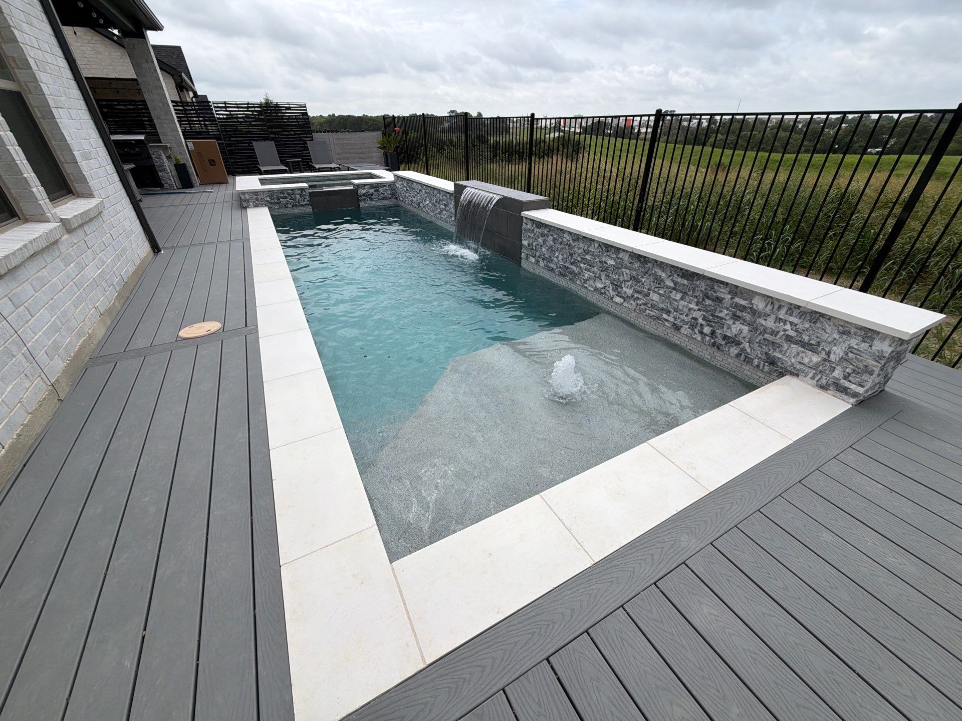 Modern Geometric Plunge Pool with Tanning Ledge by Pinnacle Pools and Spas - DFW