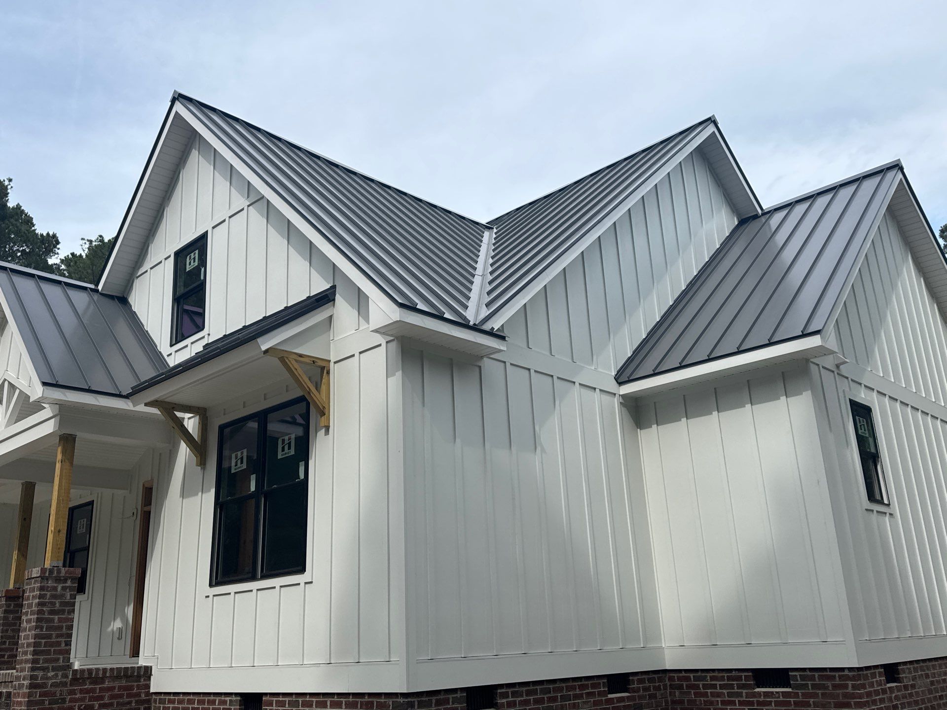 Custom New Construction Home Featuring Standing Seam Metal Roofing in Port Haywood by Cade Construction