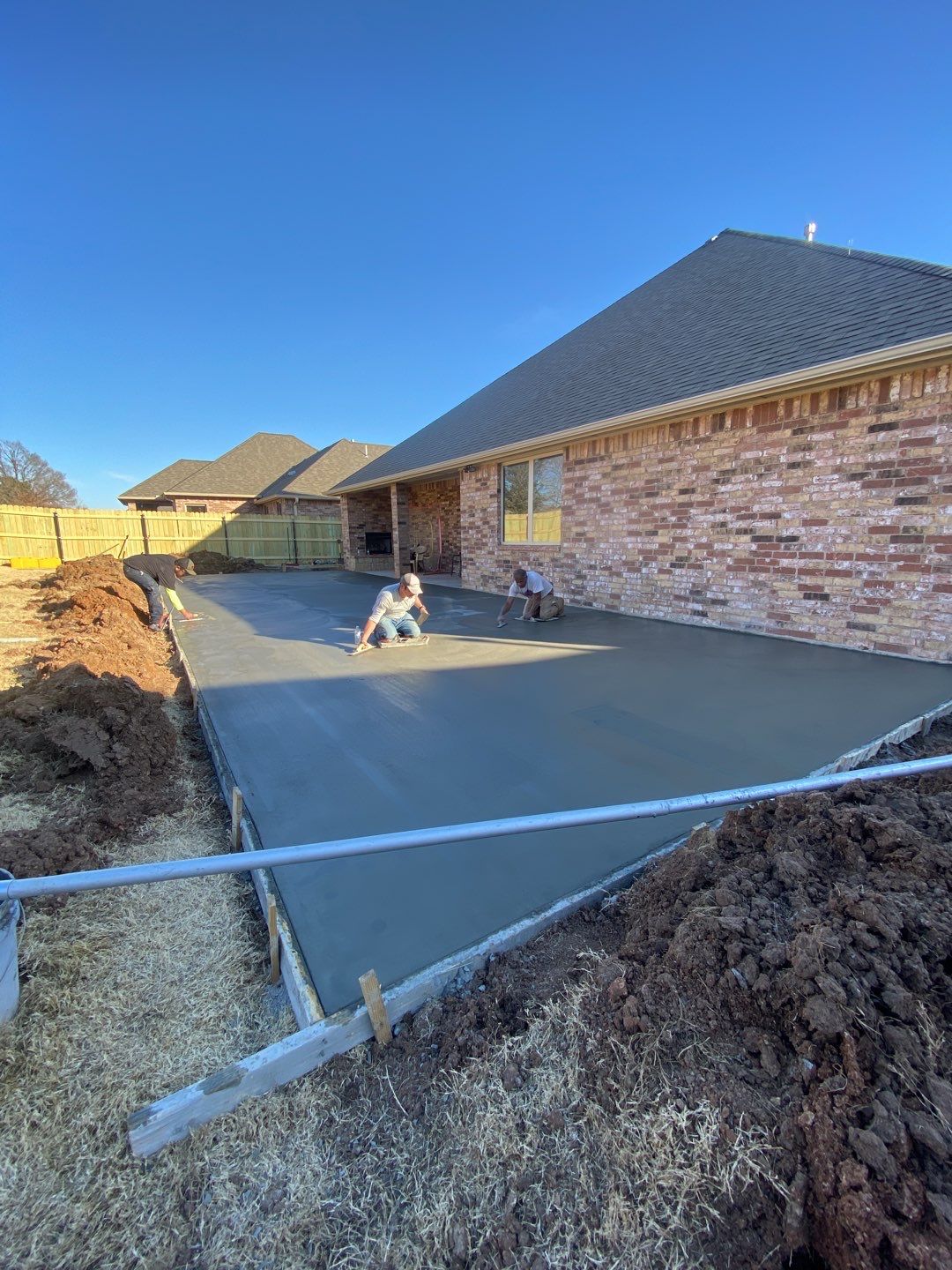 Concrete Slab , Retaining Wall , Fence, and landscape. by Clays Services Inc