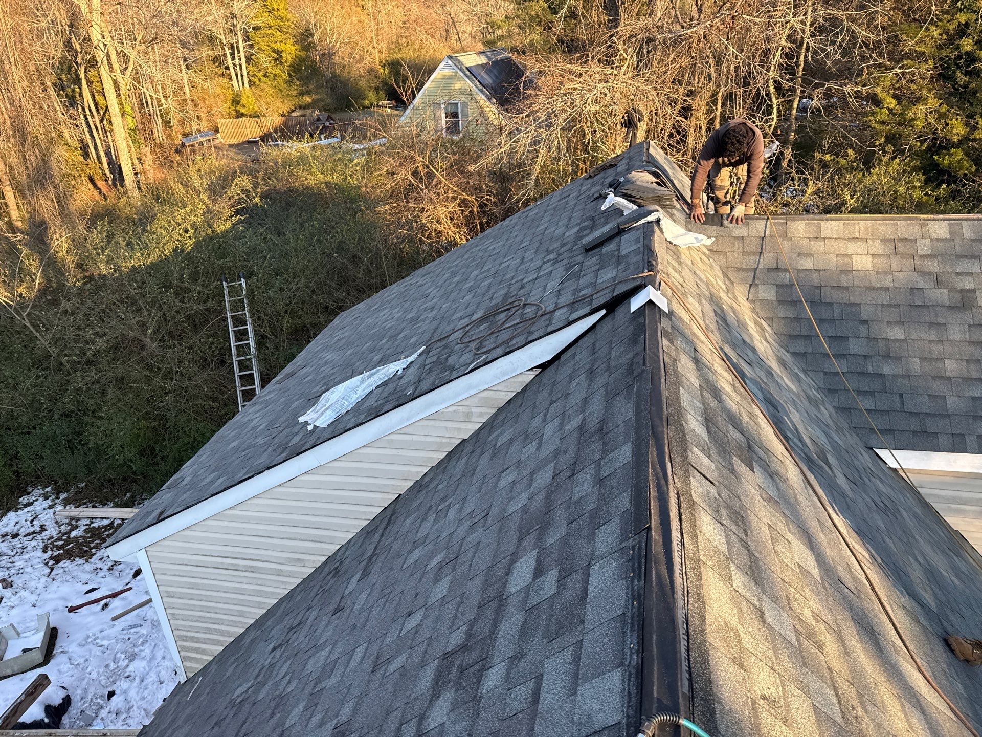 Gloucester Exterior Overhaul with Navy Blue Siding and New Roof by Cade Construction