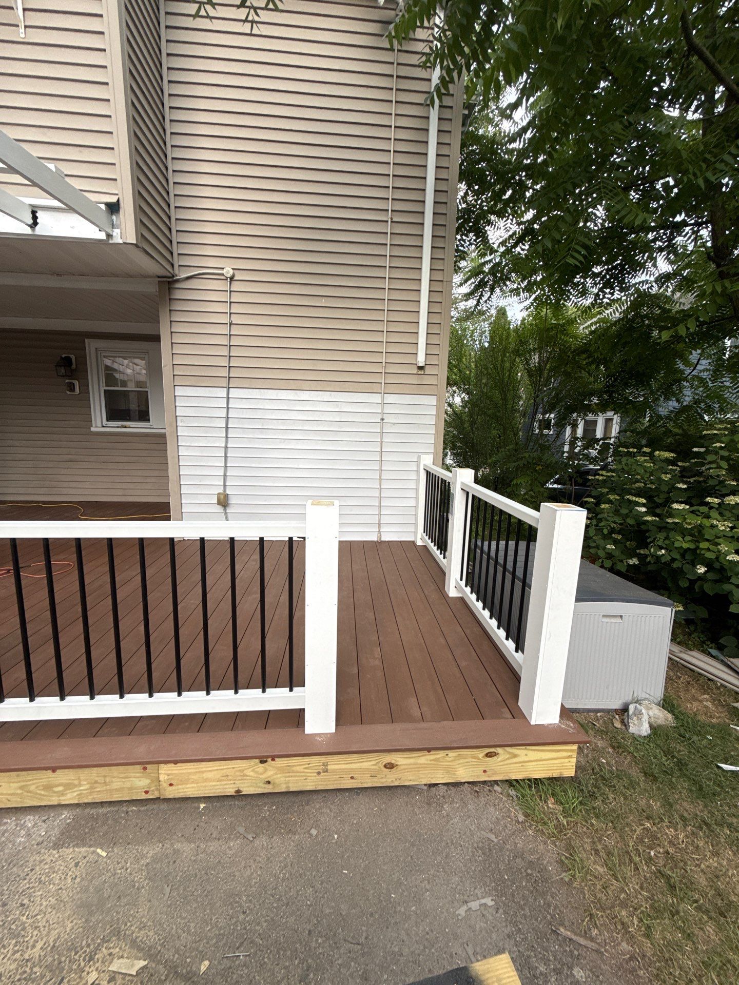 new deck with custom pergola by CabralCarpentry & Painting LLC
