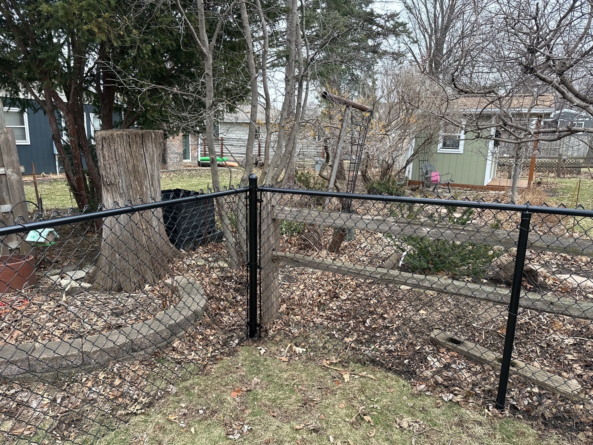 Black Vinyl Chain Link Fence Installation in Cedar Falls by Perfect Picket Fence and Stain